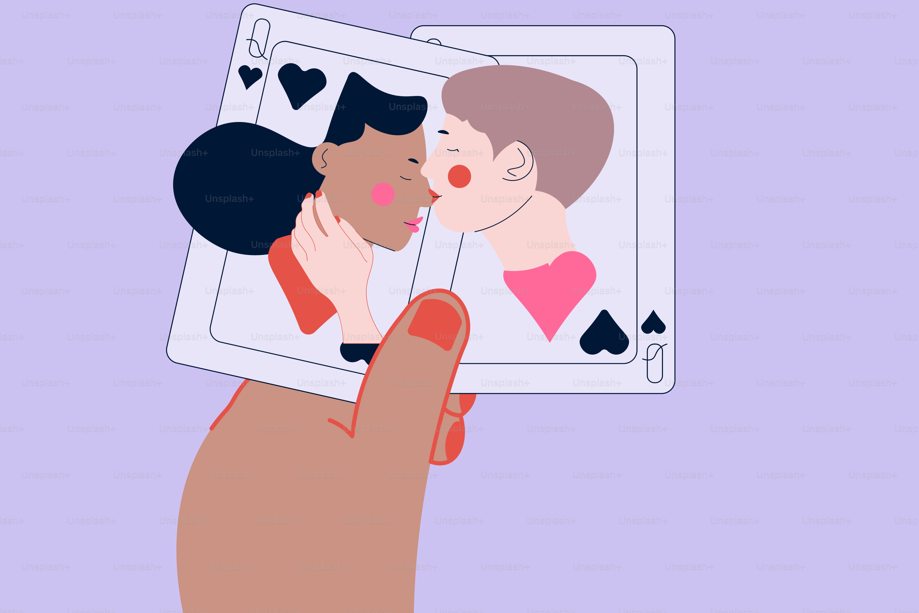A hand holding a card with a picture of two people kissing