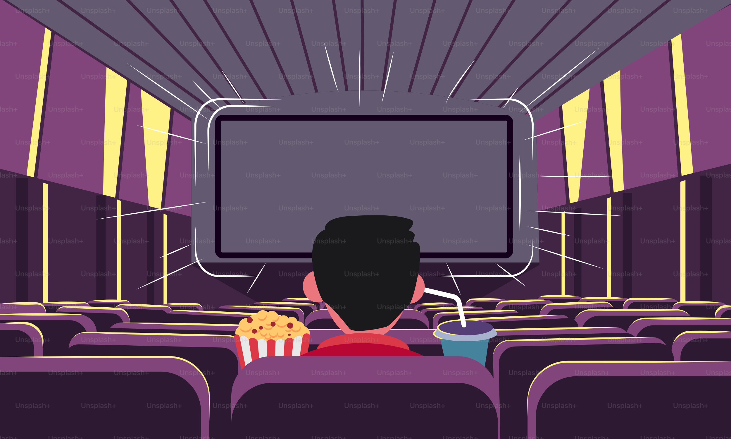 영화관에 앉아 영화를 보는 남자