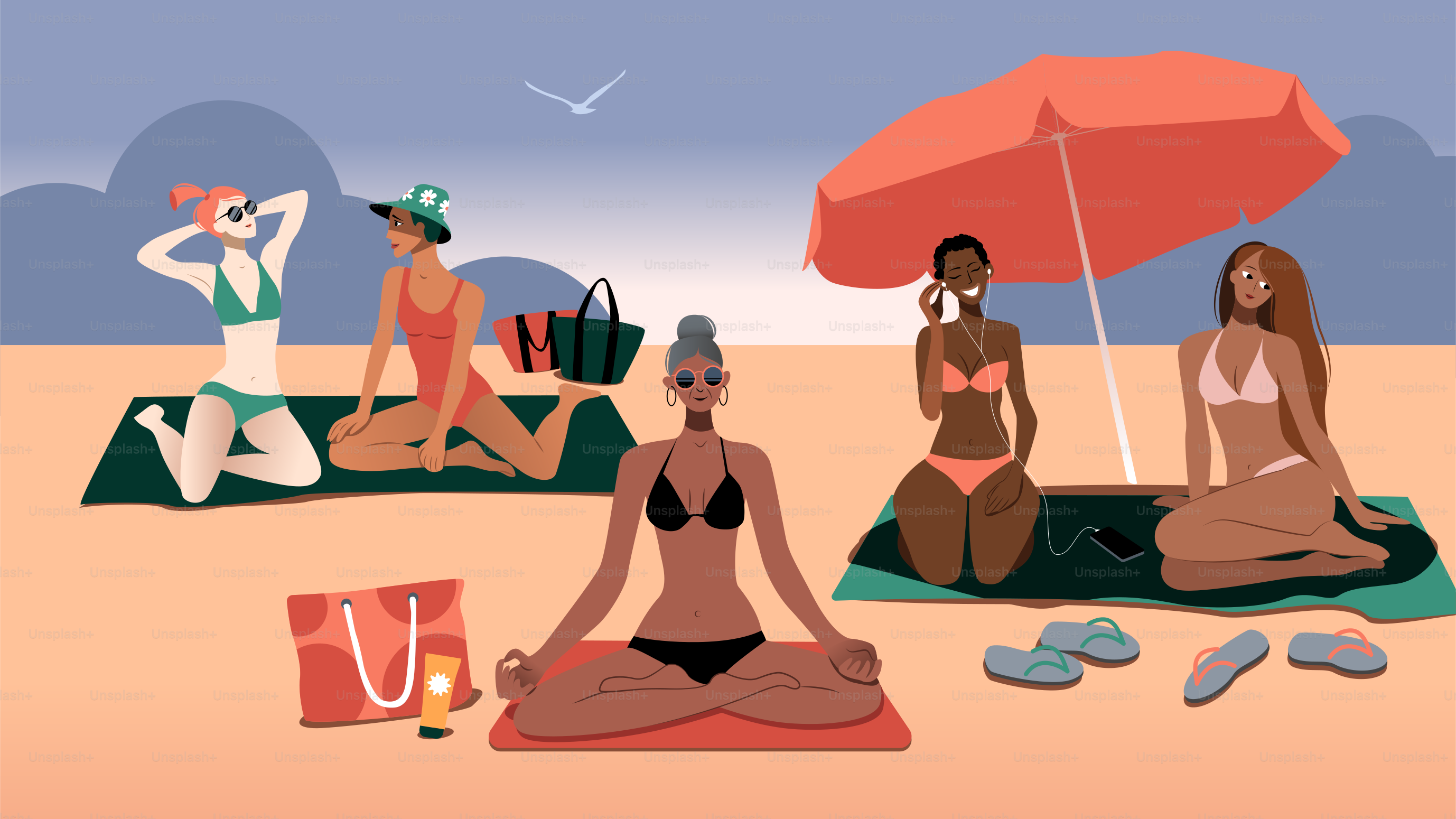 A group of people sitting on top of a beach