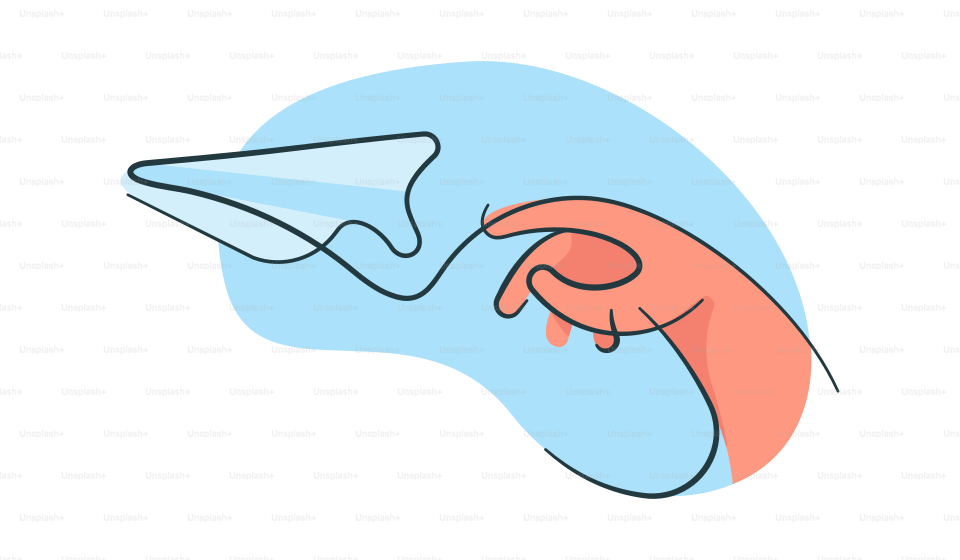 A person holding a paper airplane in their hand