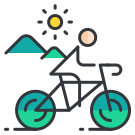 Une personne à vélo avec des montagnes en arrière-plan