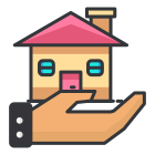 A hand holding a house with a pink roof