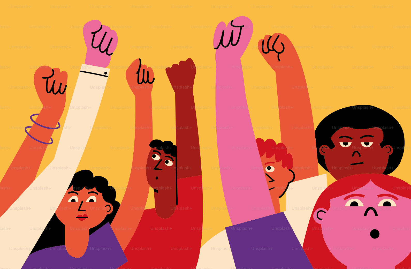 A group of people raising their hands in the air