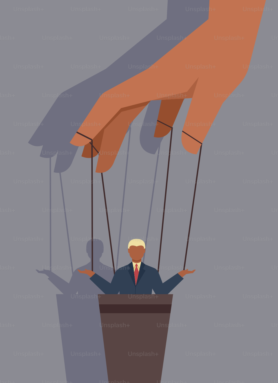 A man in a suit is suspended by strings by a hand