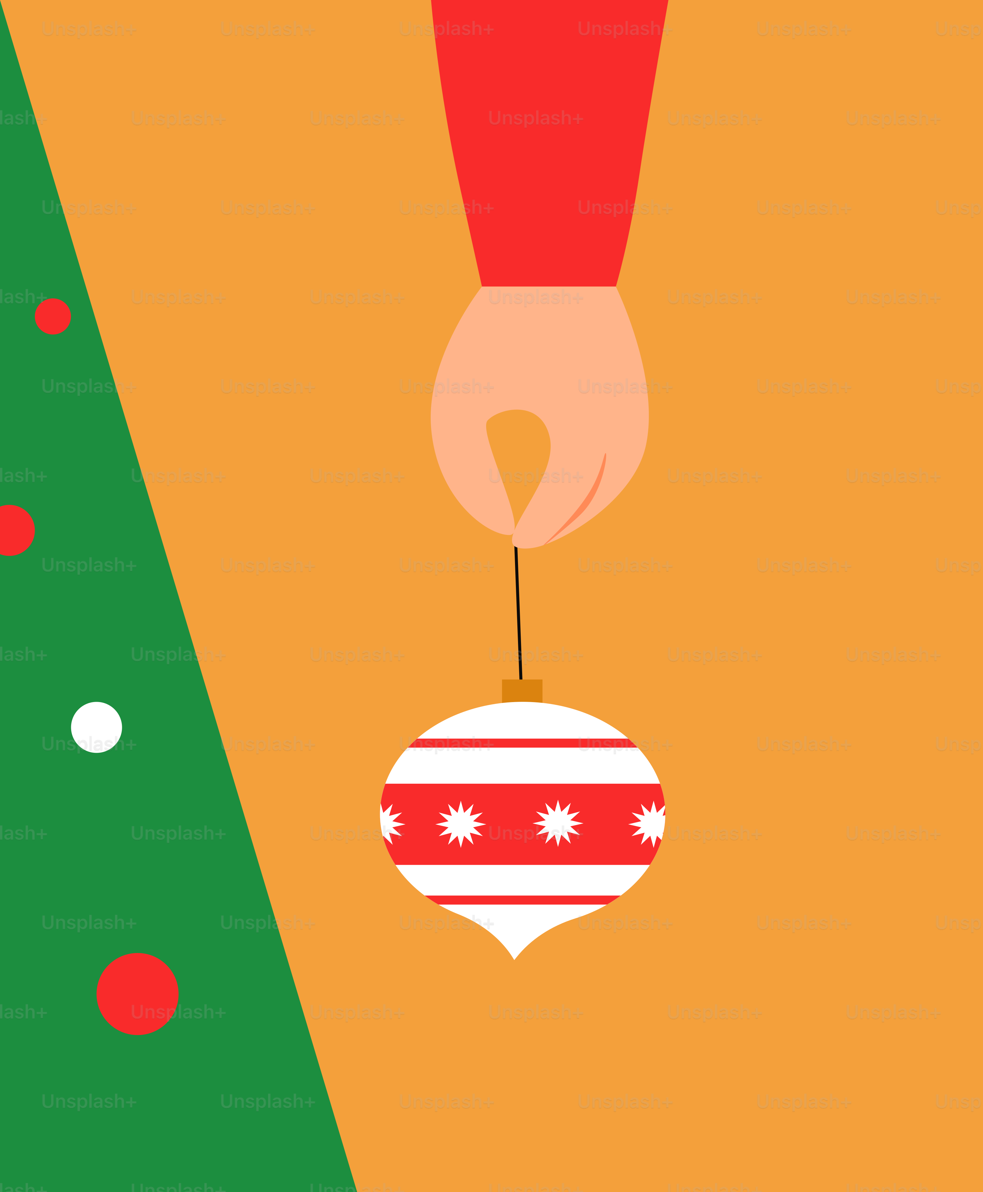 A hand holding a christmas ornament in front of a christmas tree