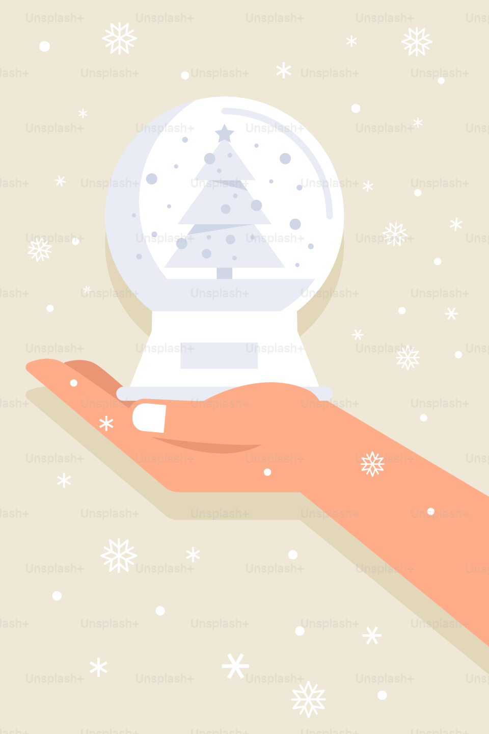 A hand holding a snow globe with a christmas tree on it