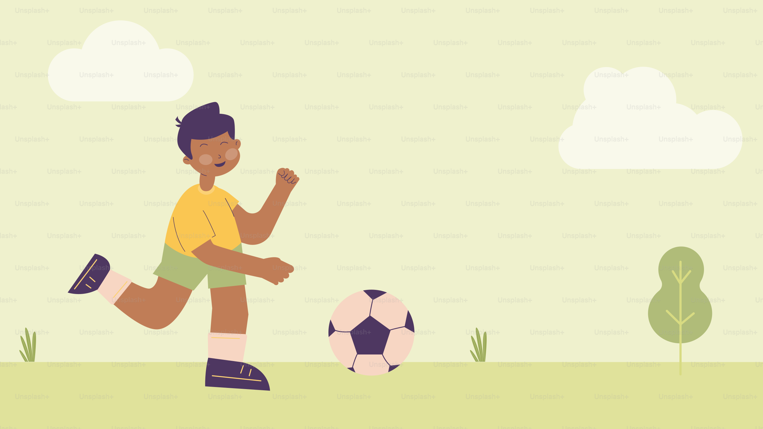 A boy kicking a soccer ball on a field