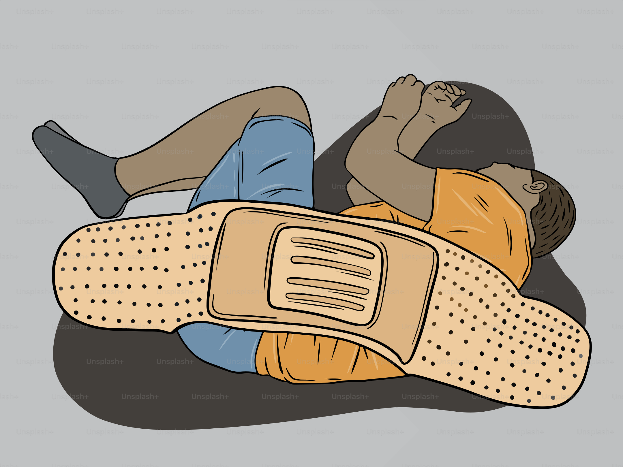 A man laying on the ground with a pillow on his back