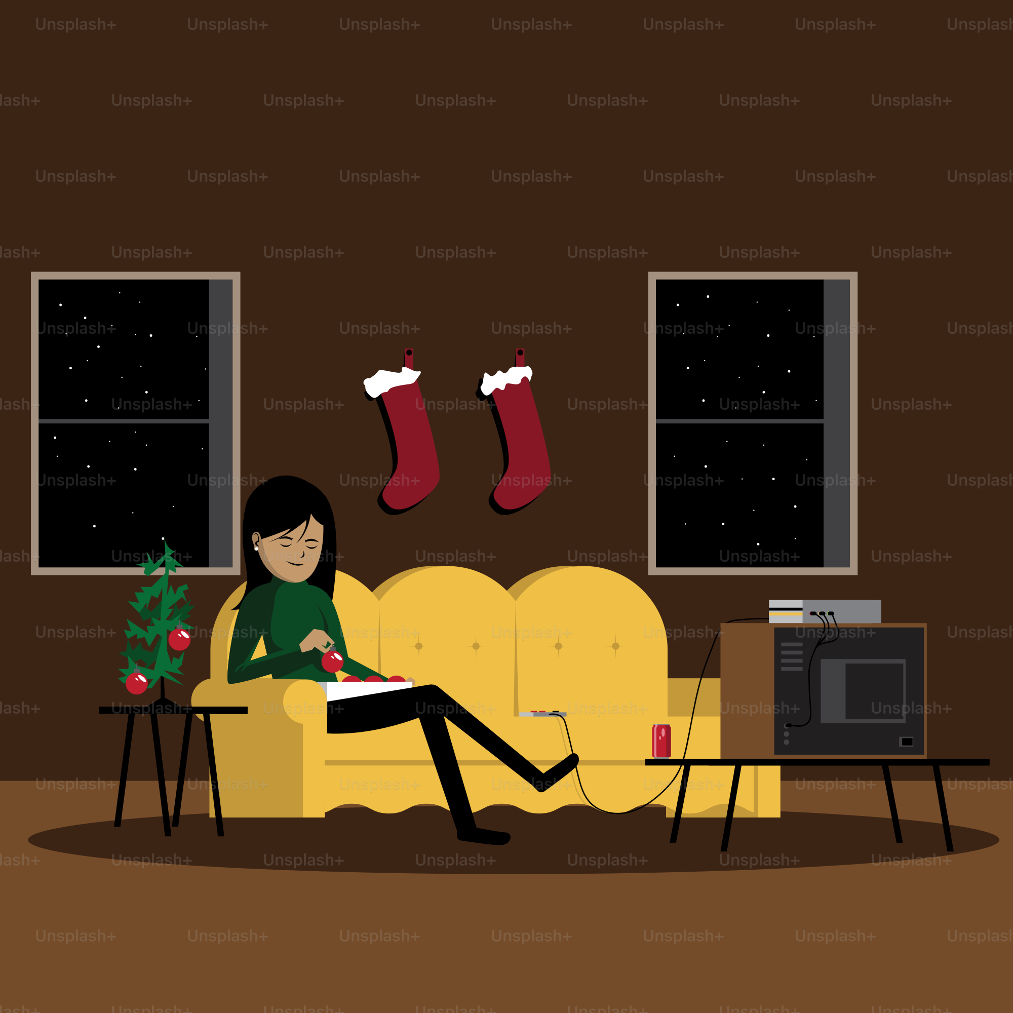 A person sitting on a couch in front of a christmas tree