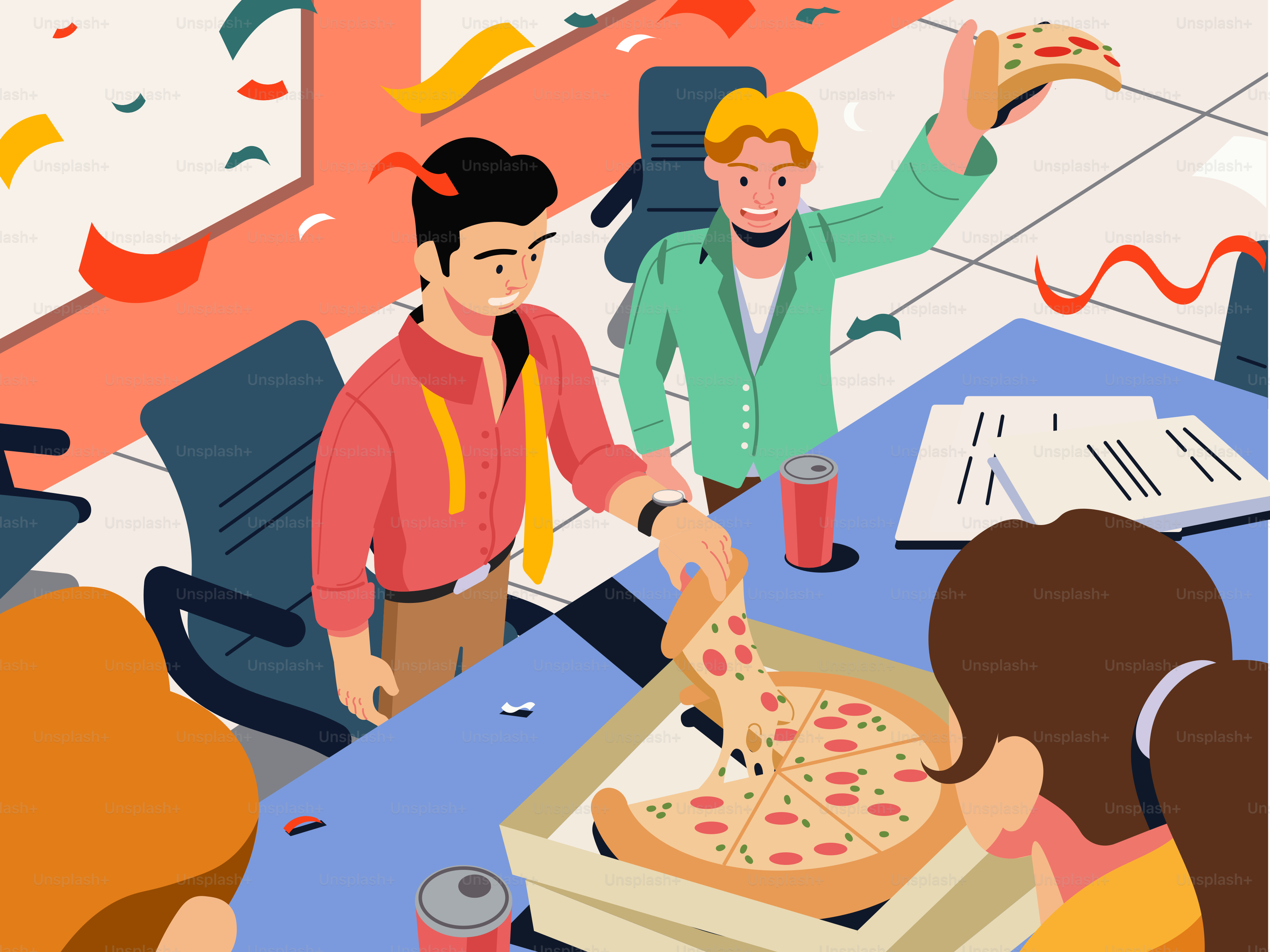 A group of people standing around a table with a pizza