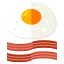 Un huevo frito y tocino en un plato
