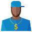 A man wearing a blue shirt and a necklace with a dollar sign on it