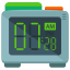 An alarm clock with a green and orange clock face