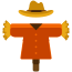 A scarecrow with a hat and orange coat