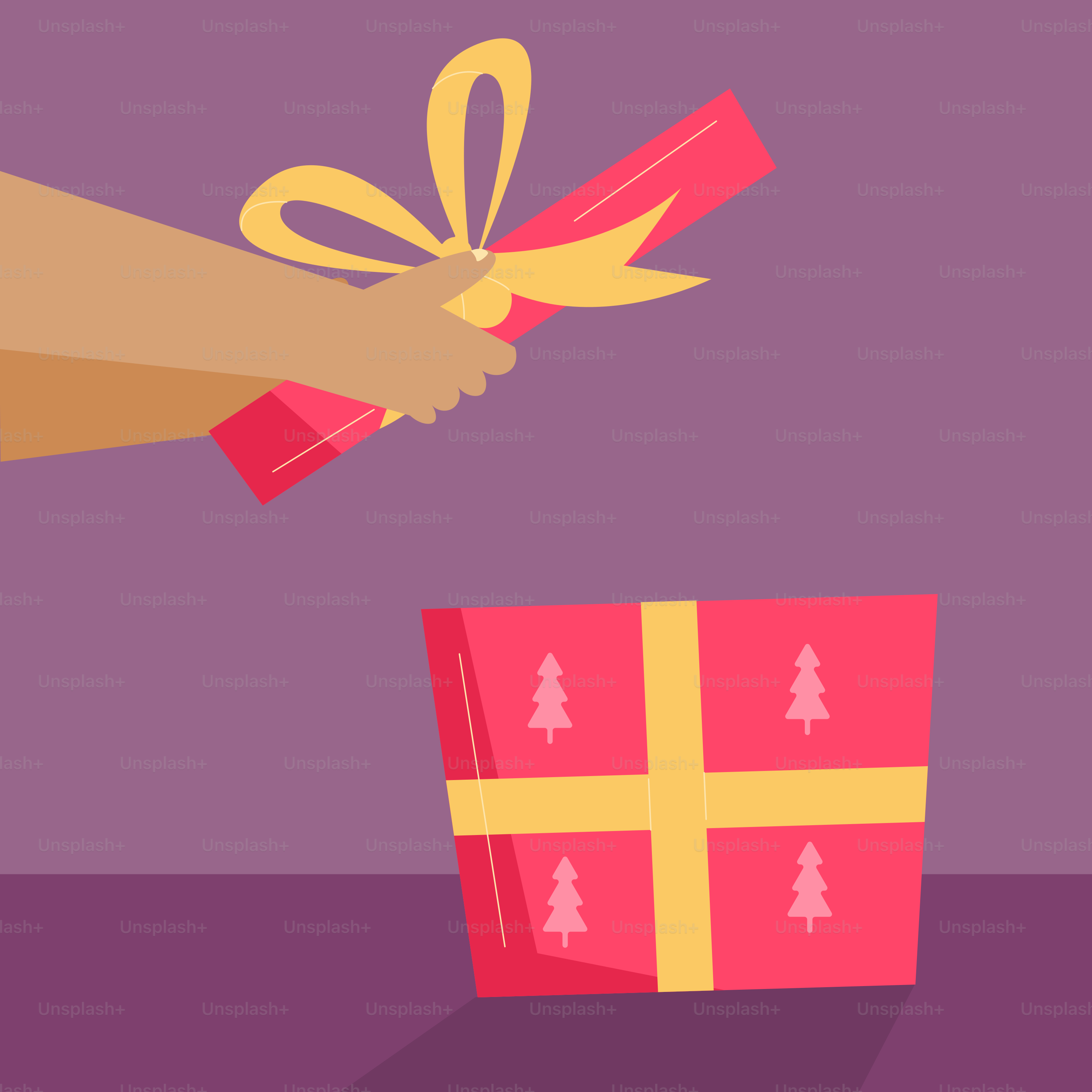 A hand holding a wrapped gift box with a ribbon