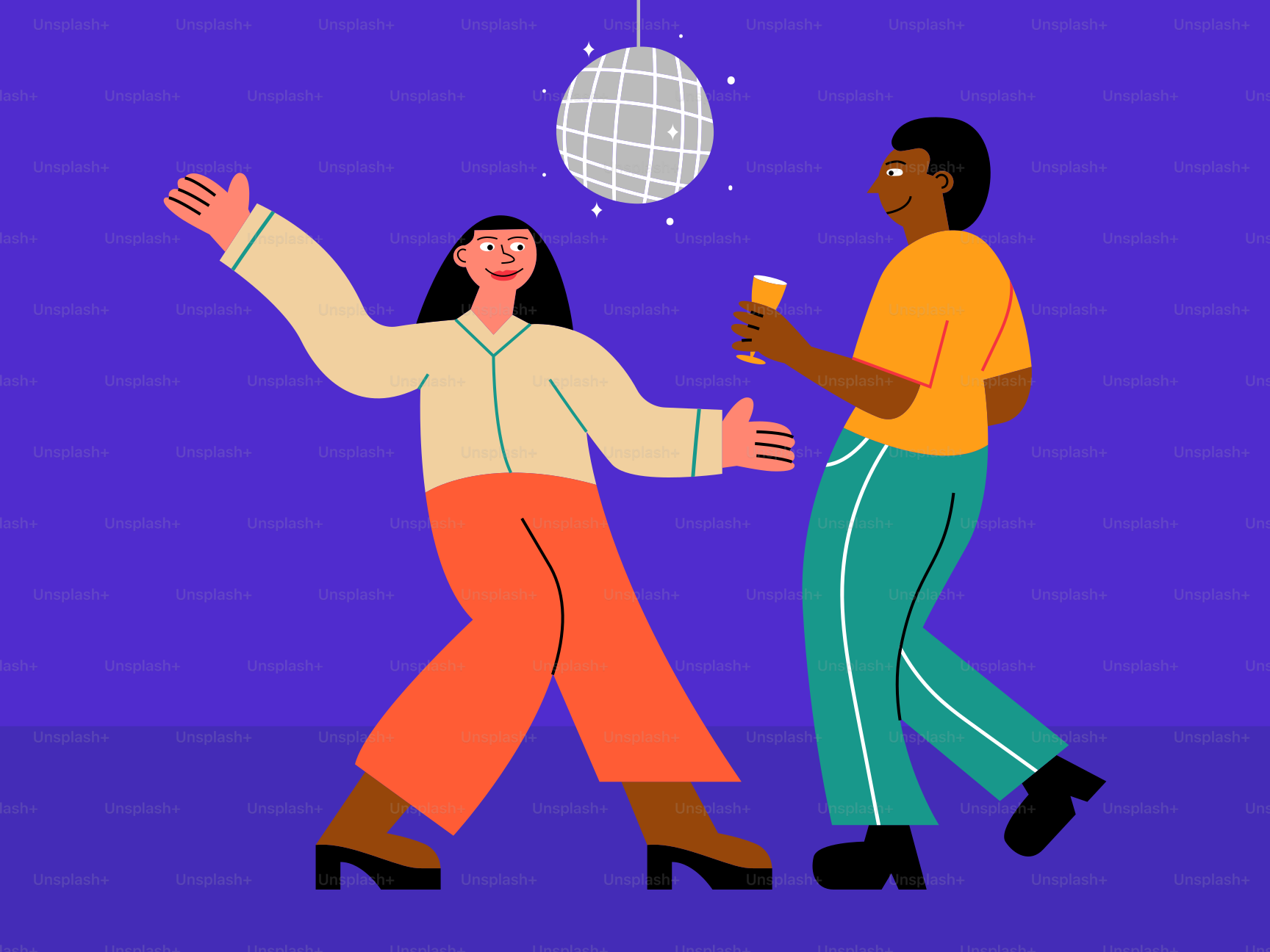 Deux personnes dansant avec une boule disco suspendue au plafond
