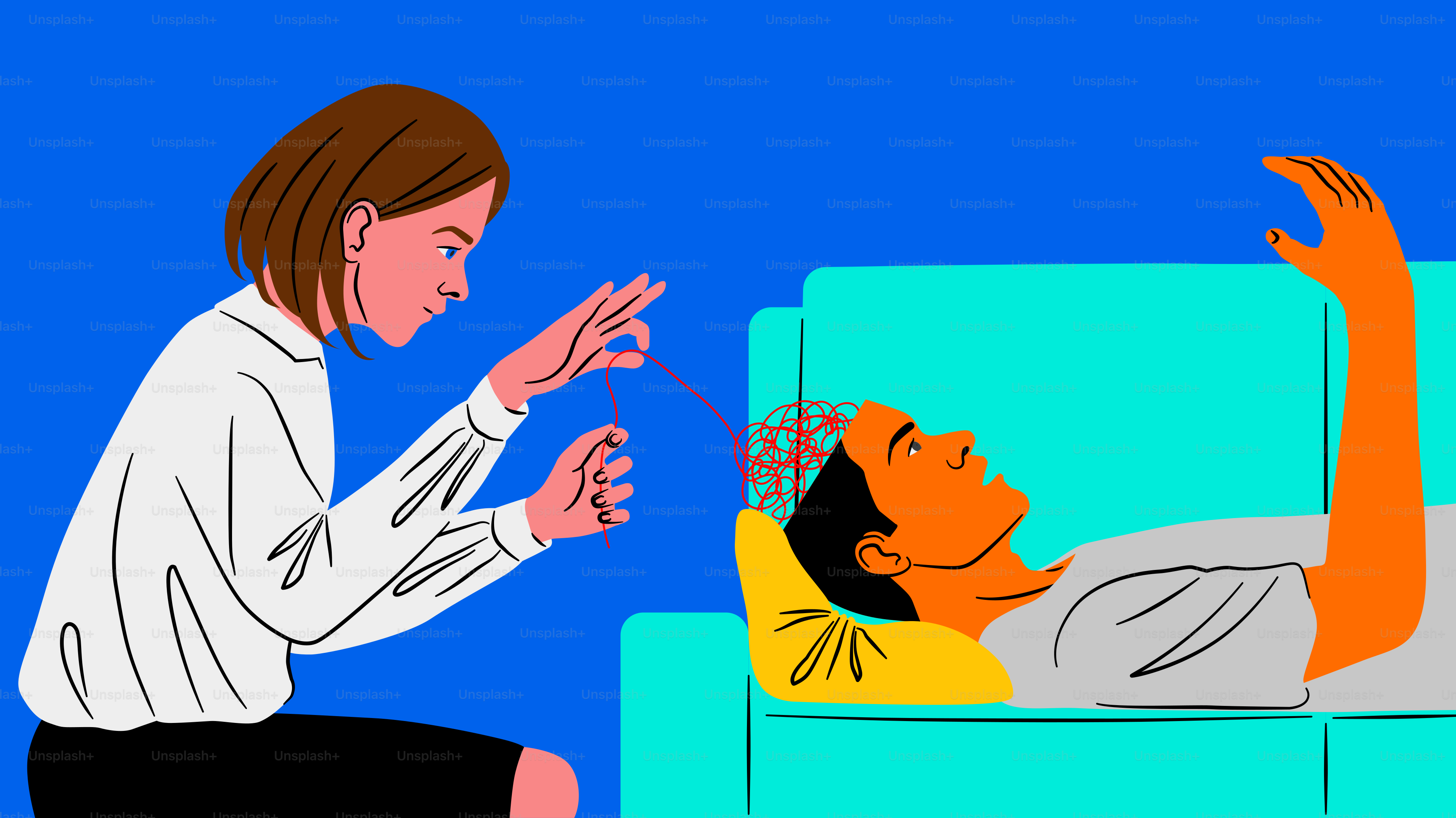 A woman sitting on a couch with a man laying on the couch