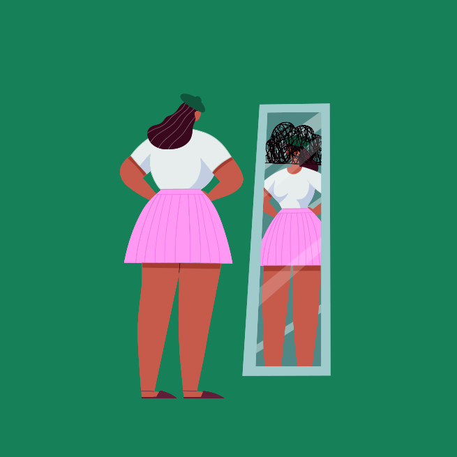 A woman standing in front of a mirror