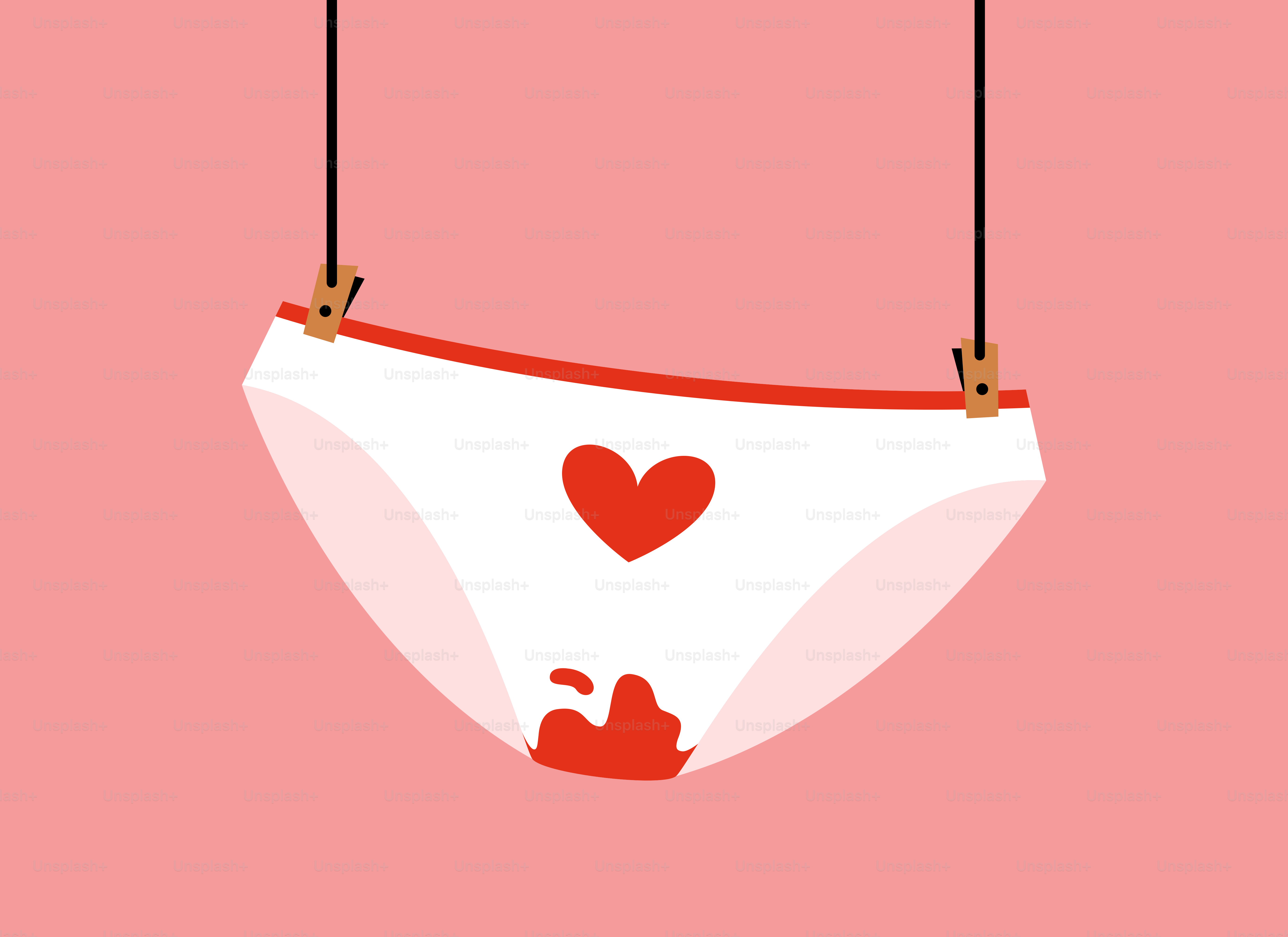 A white underwear hanging from a string with a red heart on it