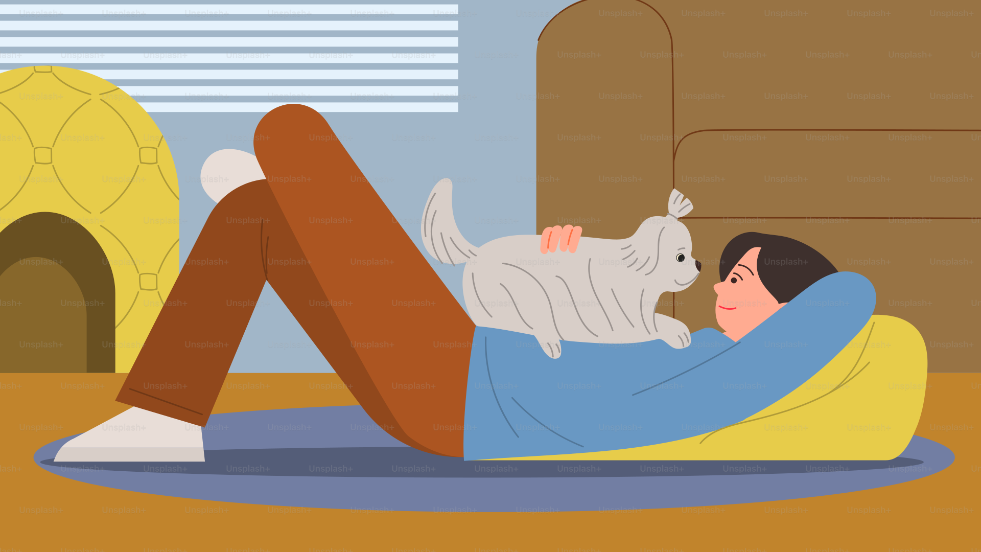 A man laying on the floor with a cat on his back