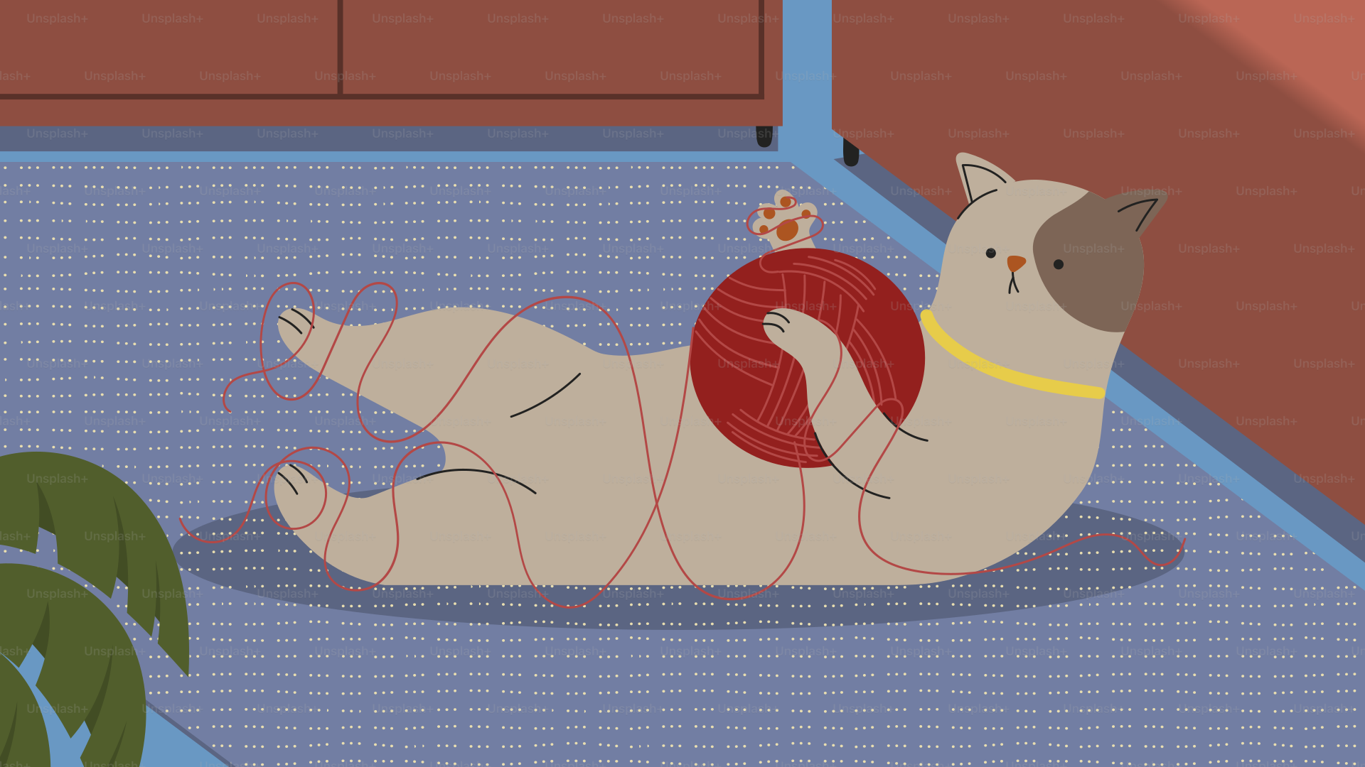 A cat laying on the floor with a ball of yarn
