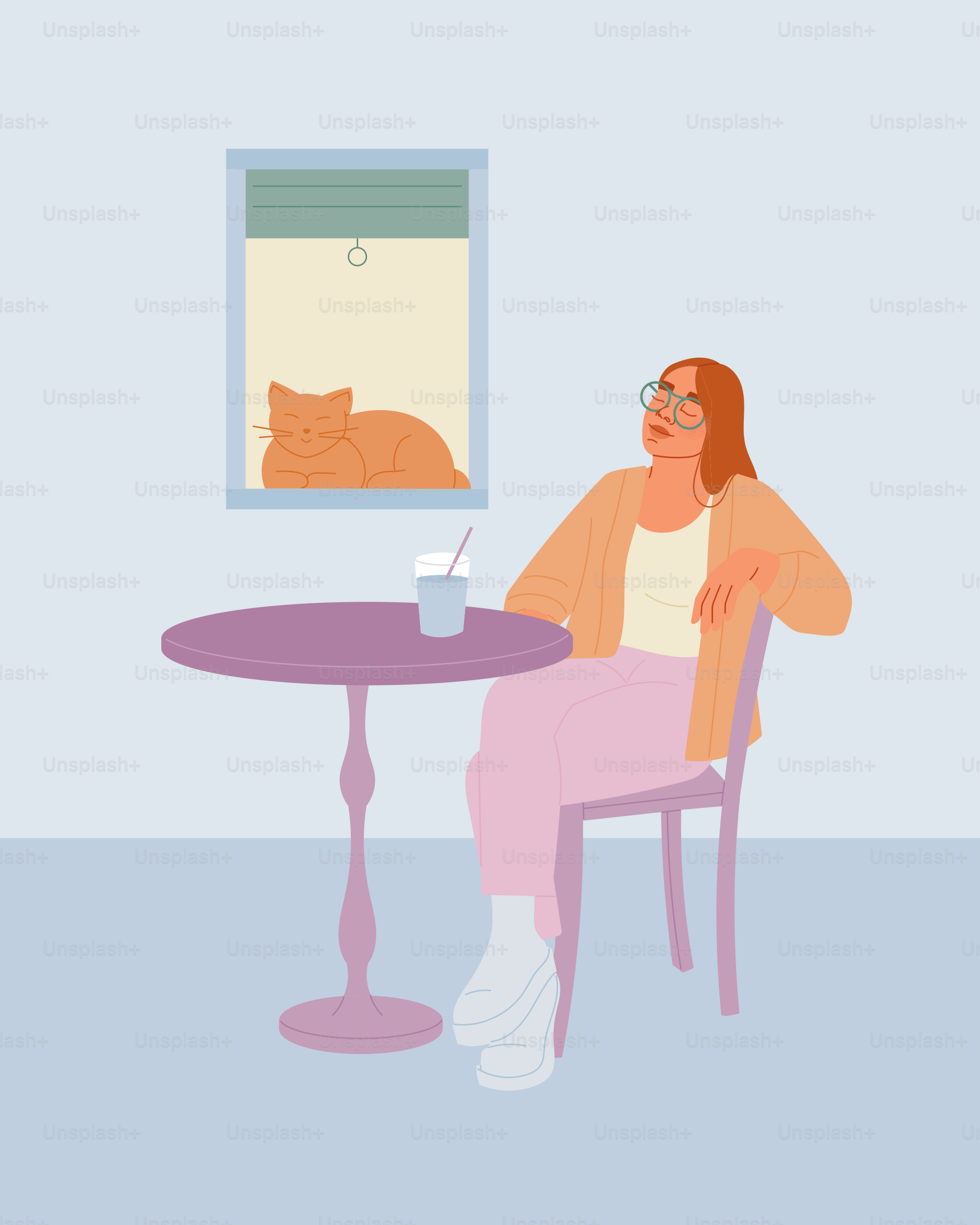 Una donna seduta a un tavolo davanti a un gatto
