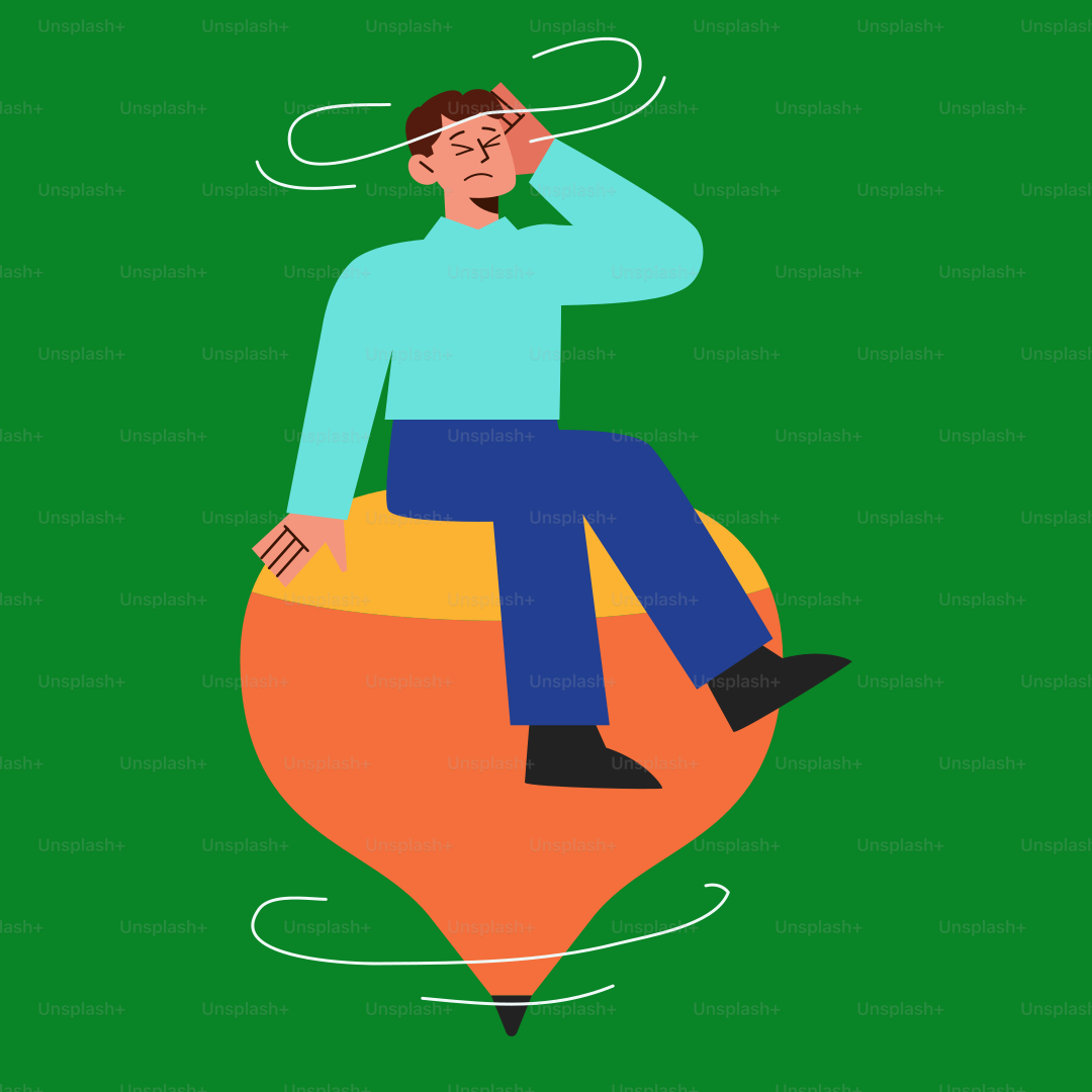 Un homme assis sur un ballon, la tête dans les mains