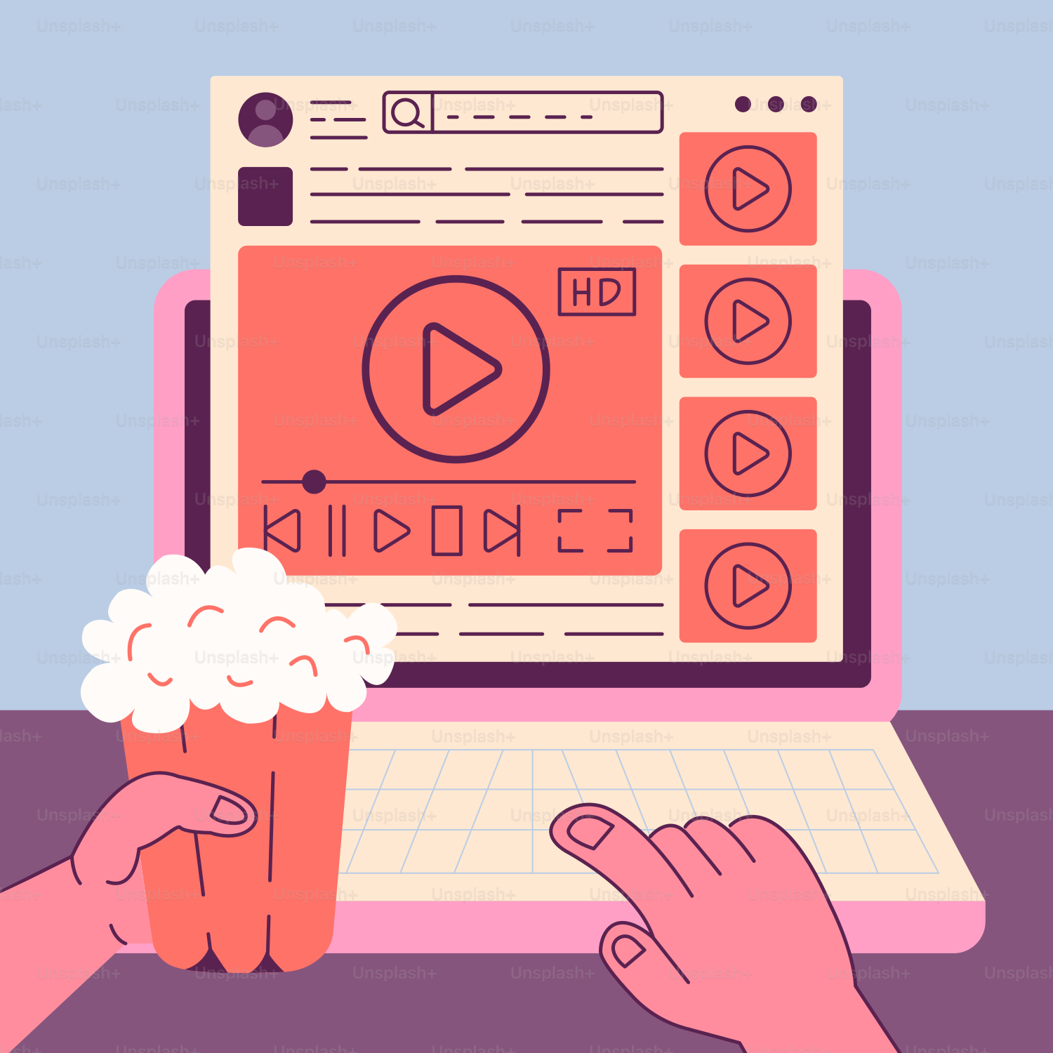 A person using a laptop with a cup of popcorn in front of them