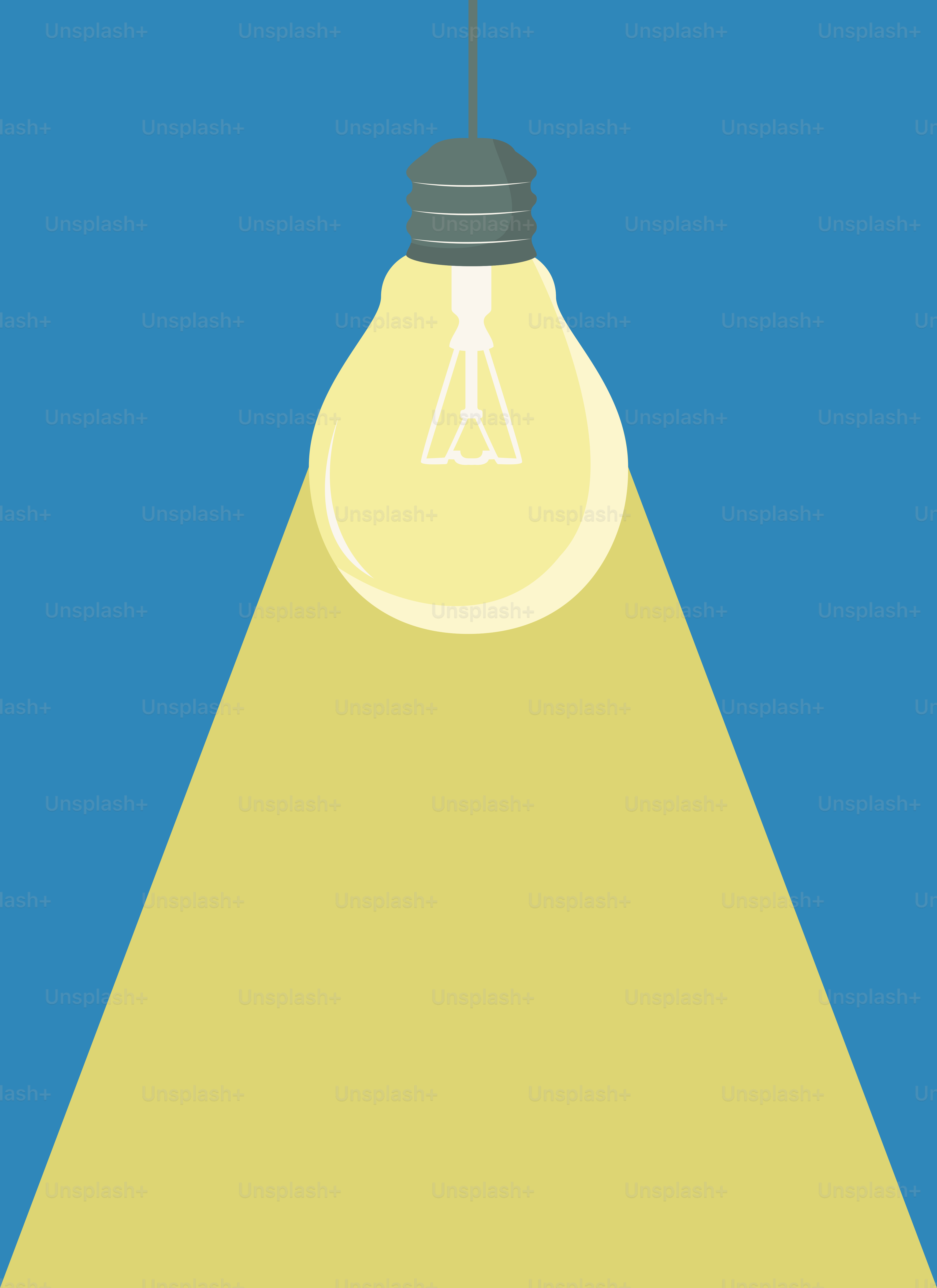 A yellow light bulb hanging from a ceiling