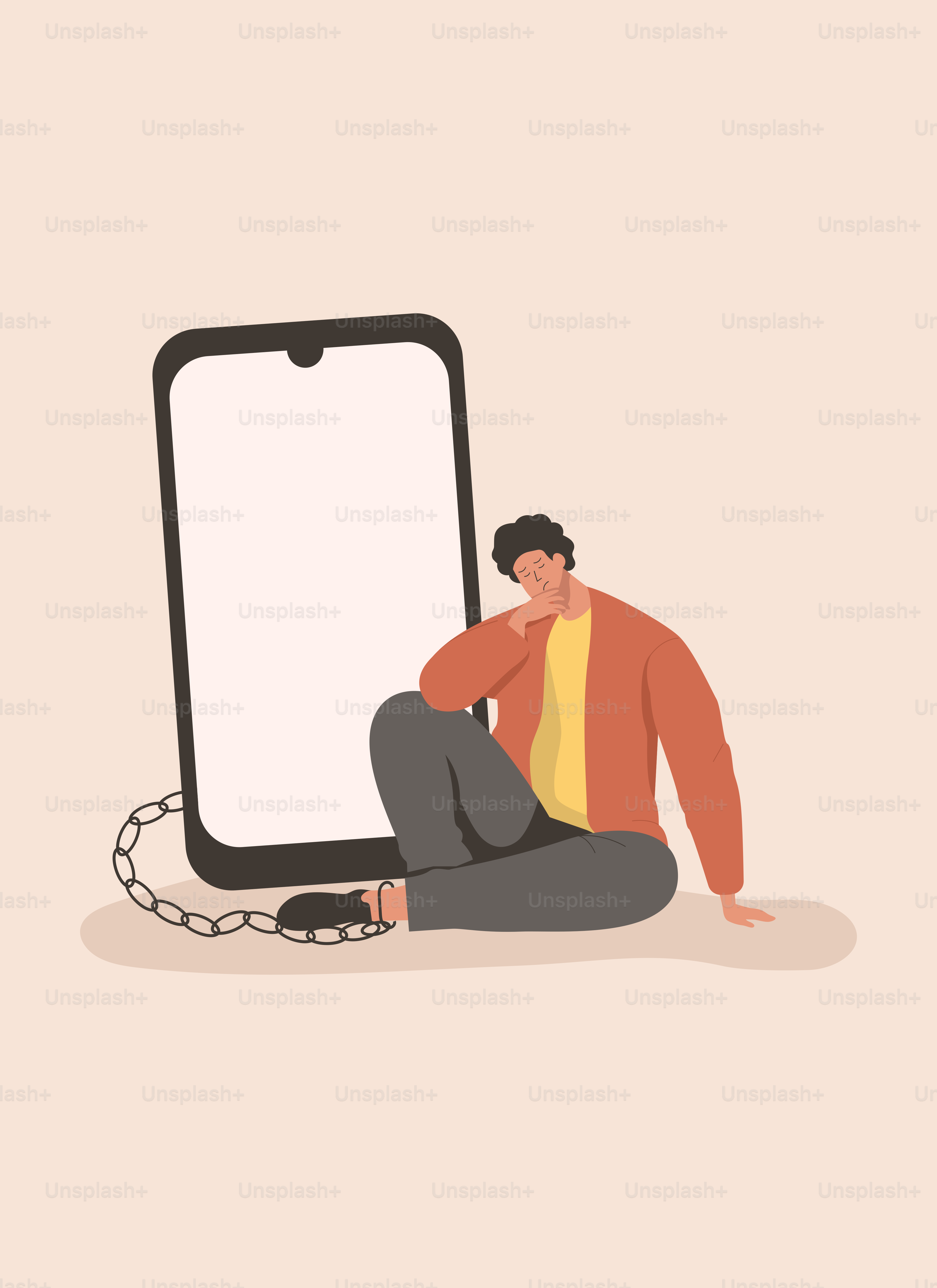 電話の隣で地面に座っている男性