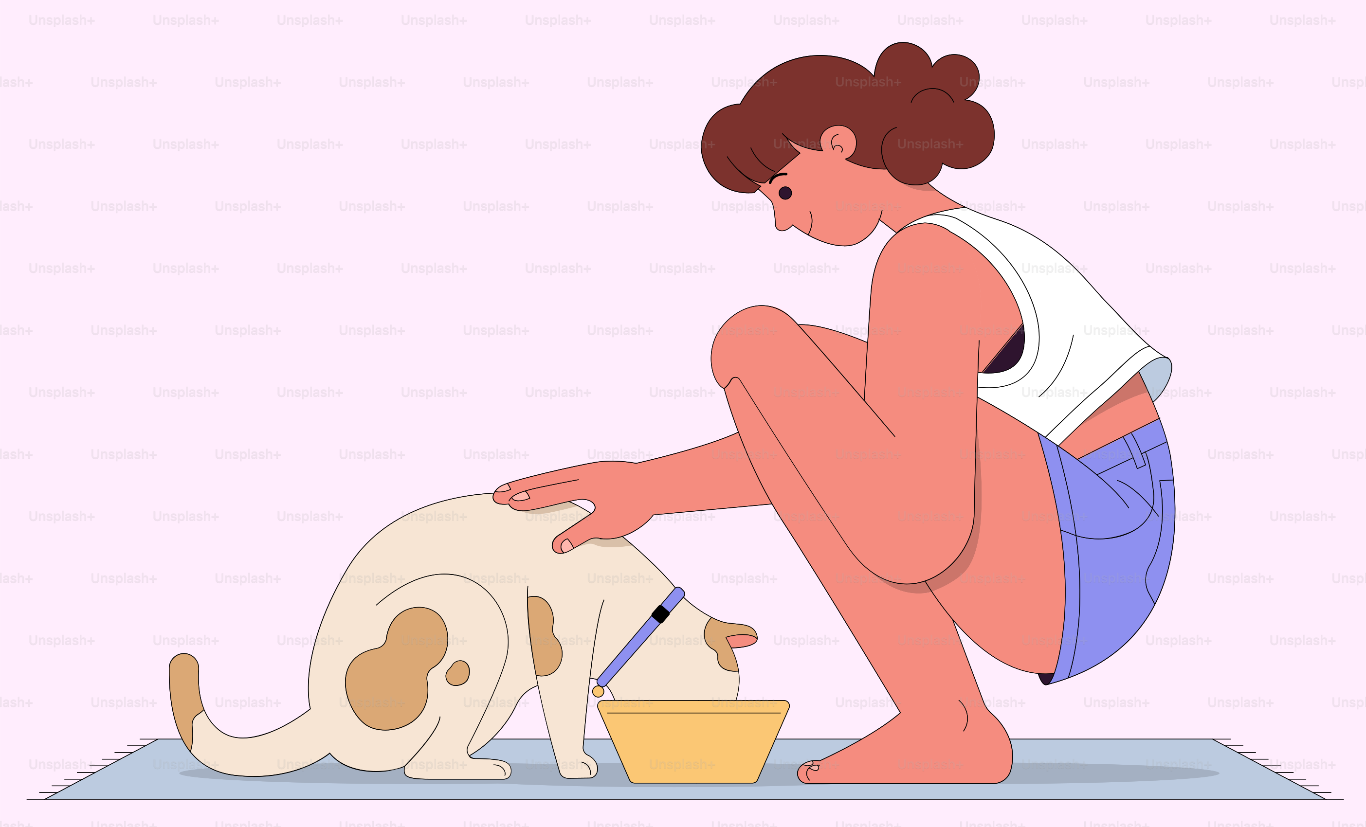 A woman sitting on the floor feeding a dog