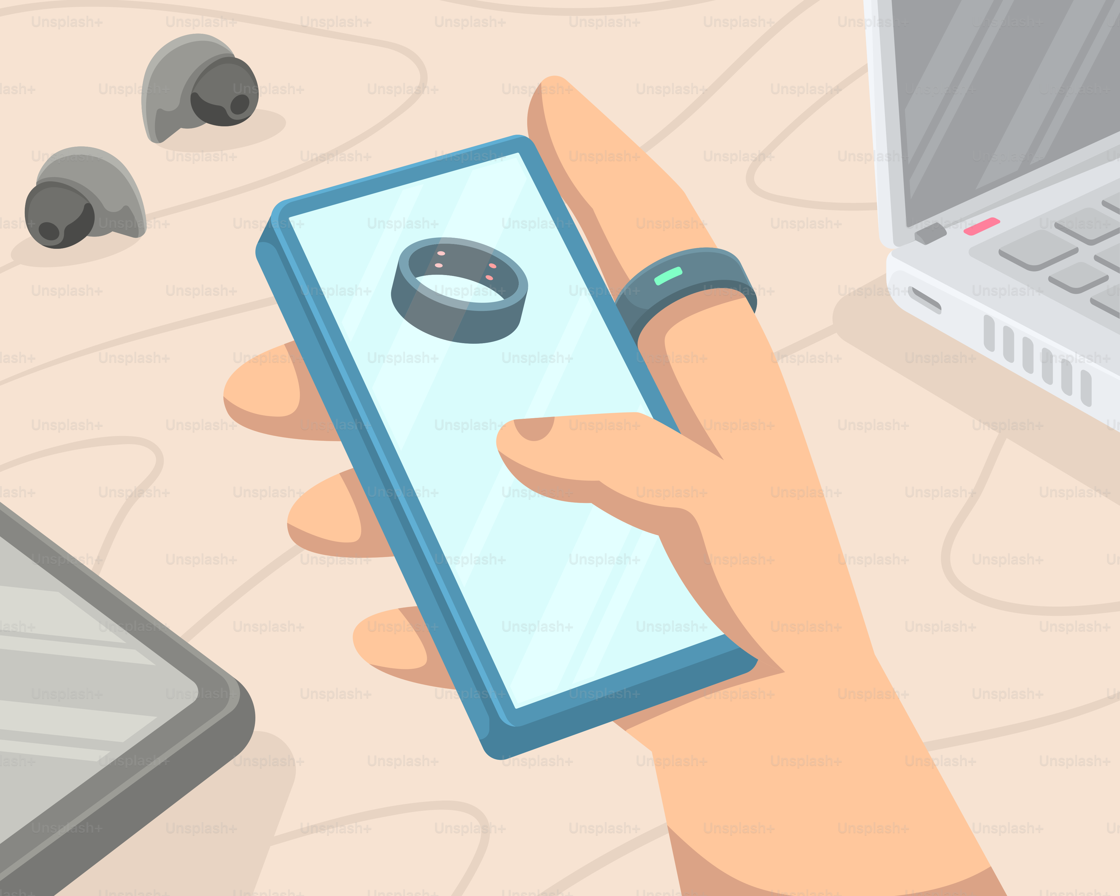 Eine Hand, die ein Smartphone neben einem Laptop hält