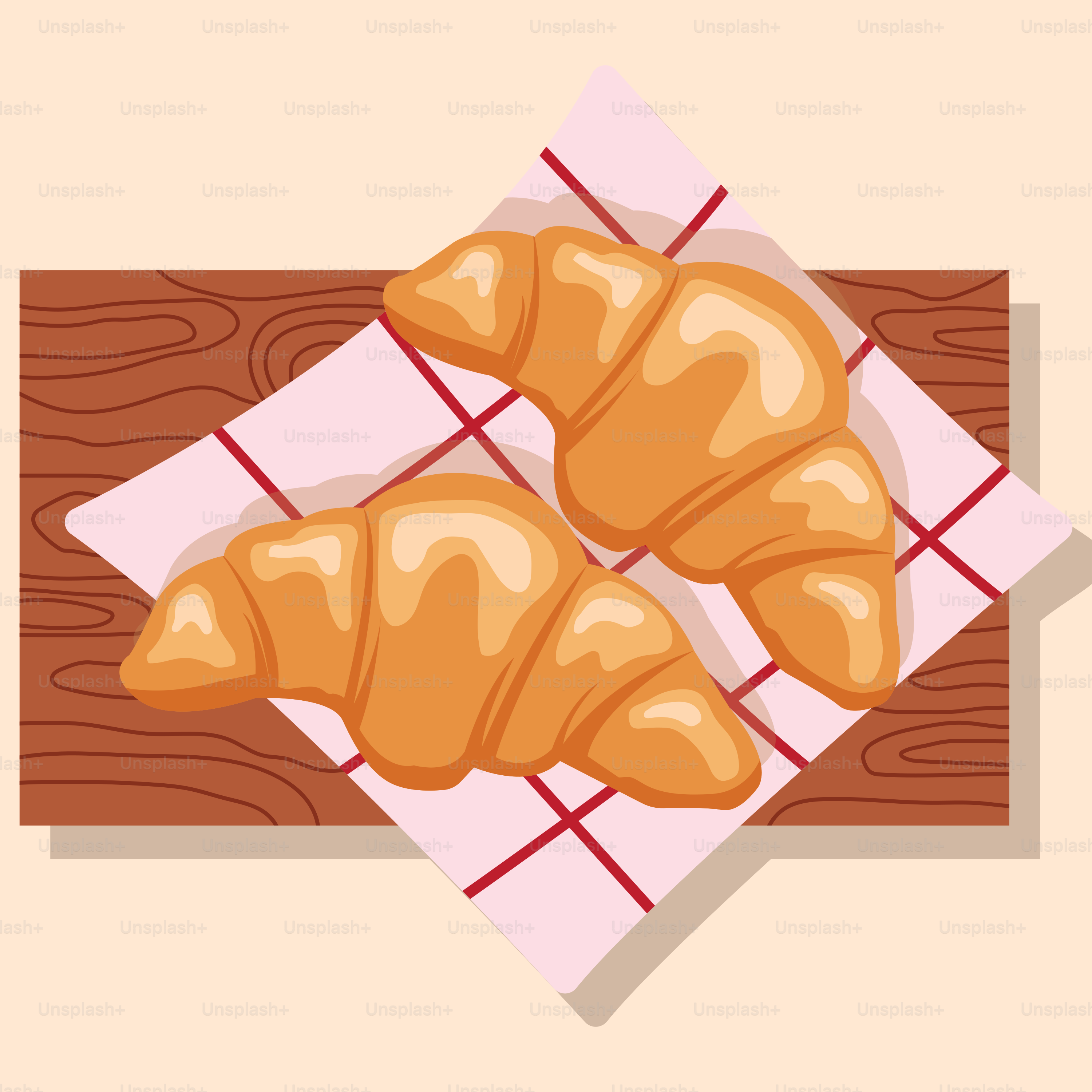 A couple of croissants sitting on top of a wooden table