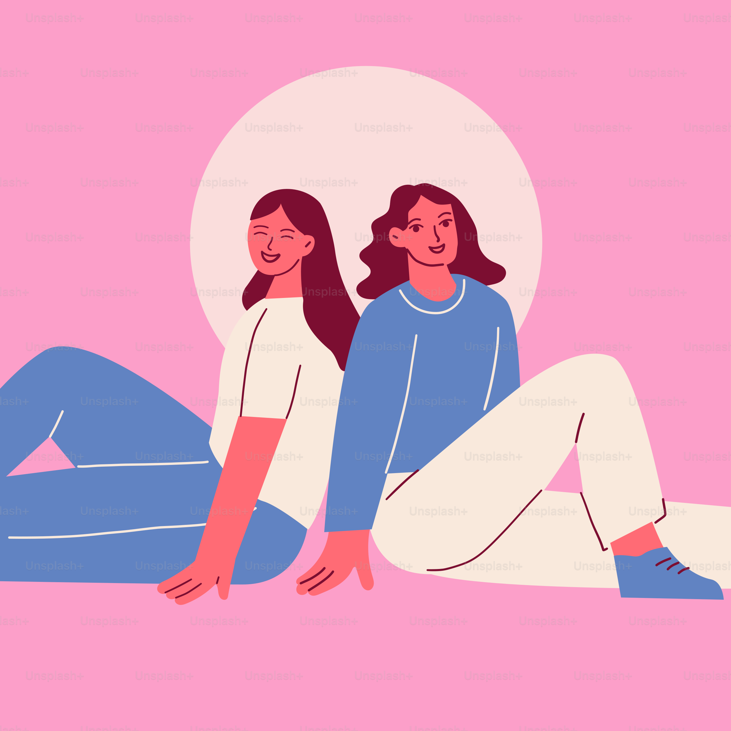 Two women sitting on the ground with their legs crossed