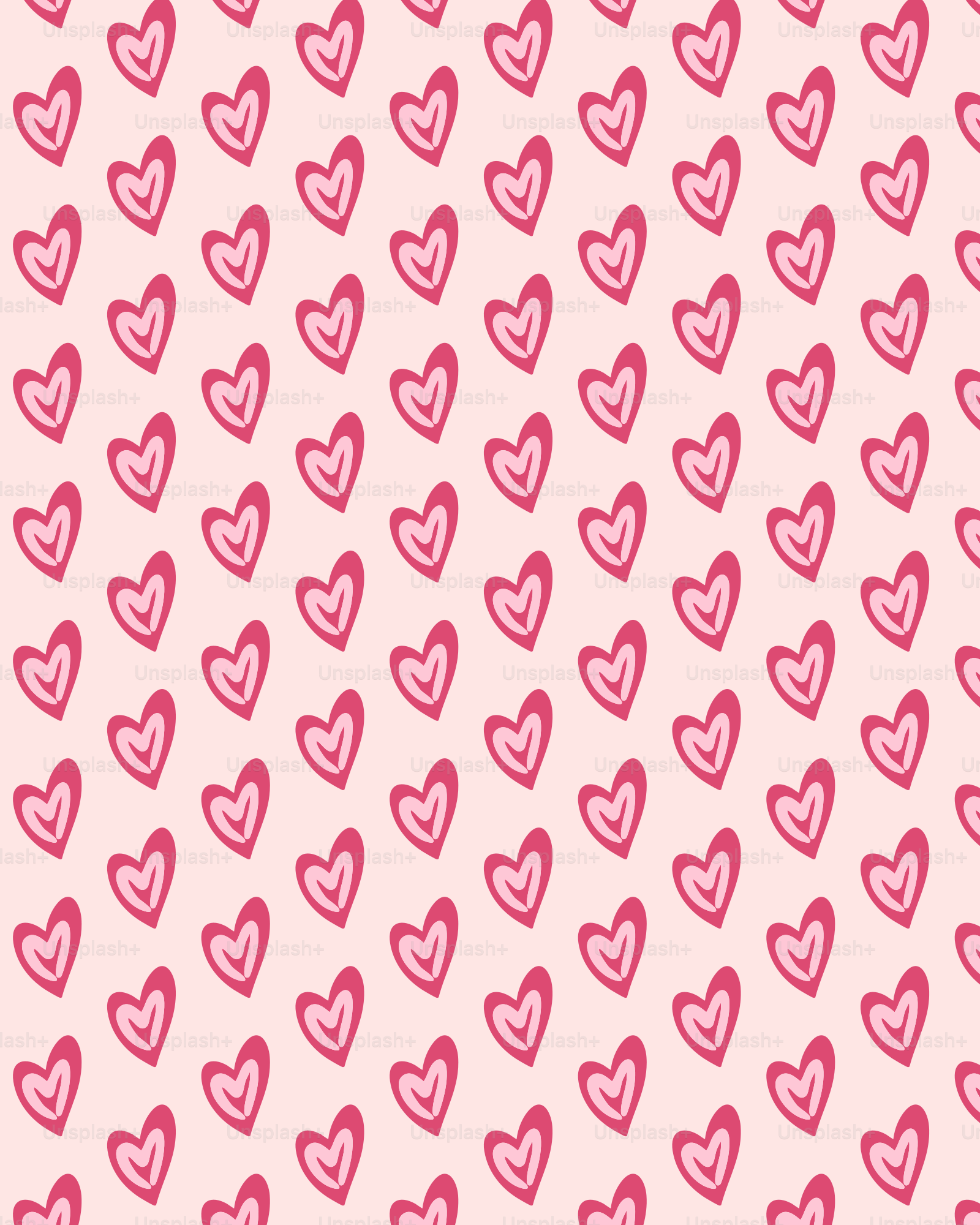 Ein Muster aus Herzen auf rosa Hintergrund