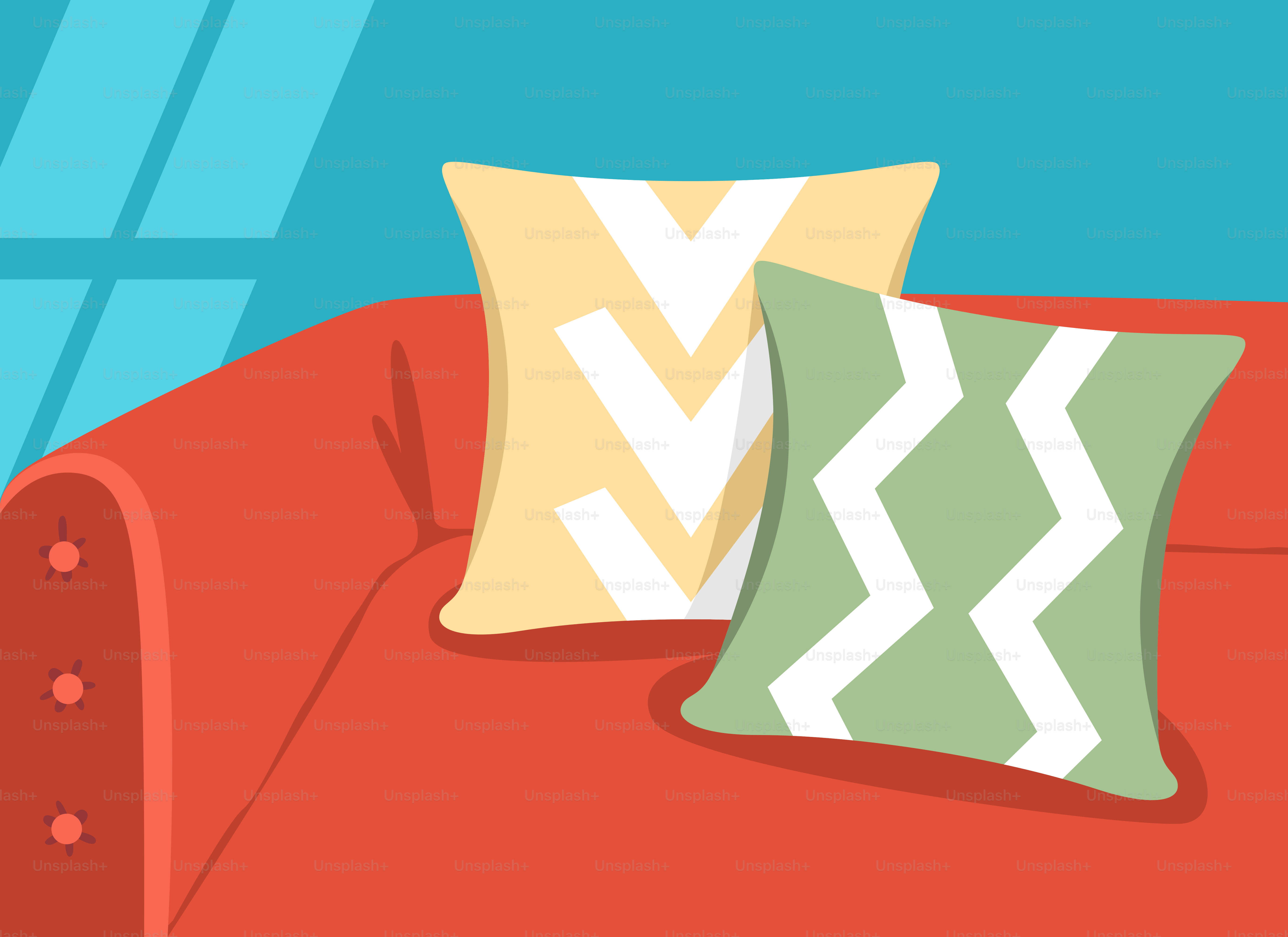 A red couch with two pillows on top of it