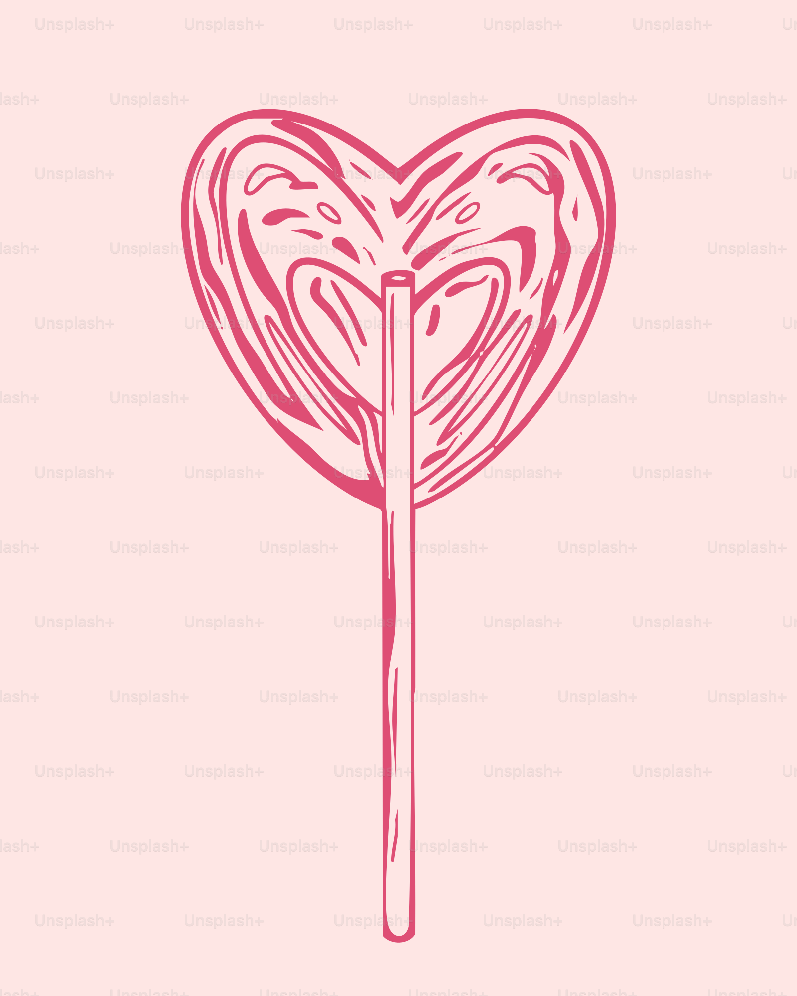 ピンクの背景にハート型のロリポップ