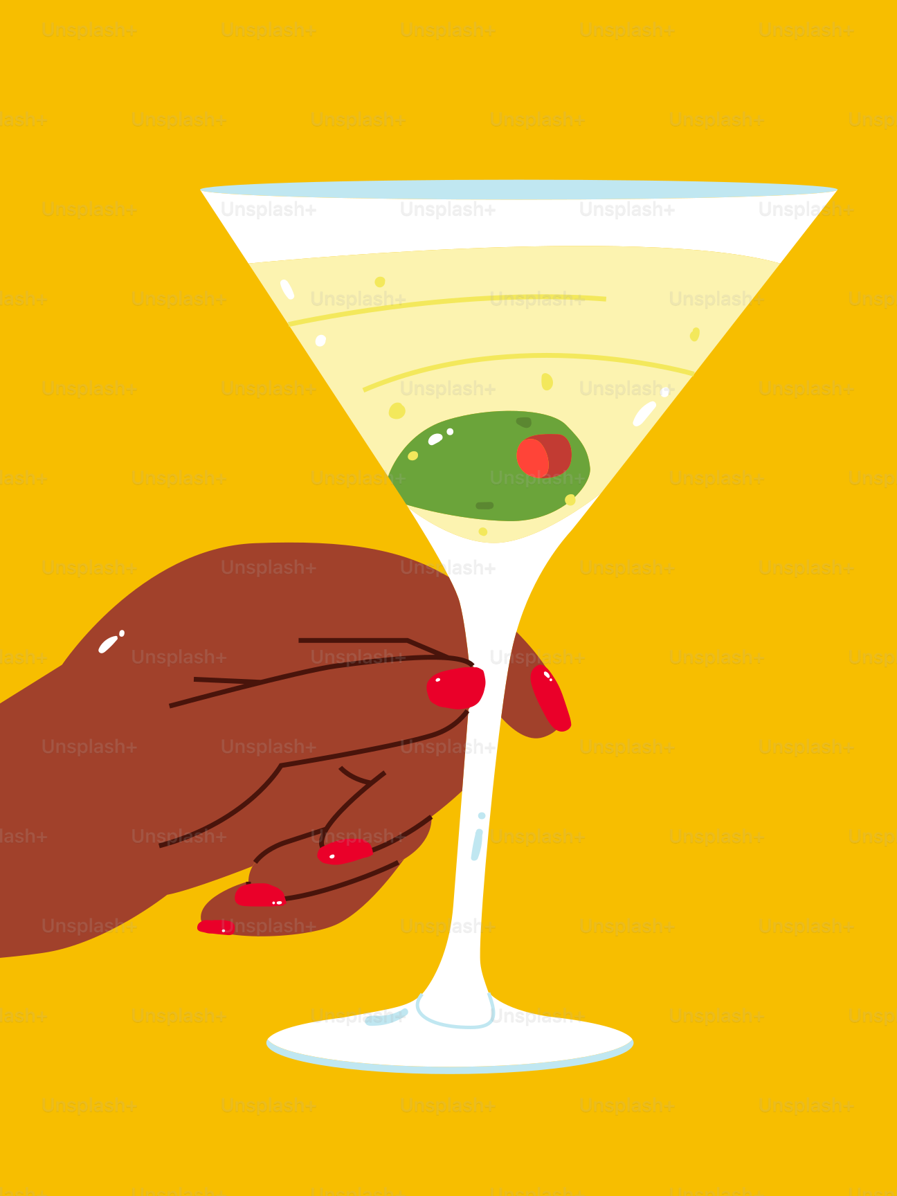 Une main tenant un verre à martini rempli d’olives