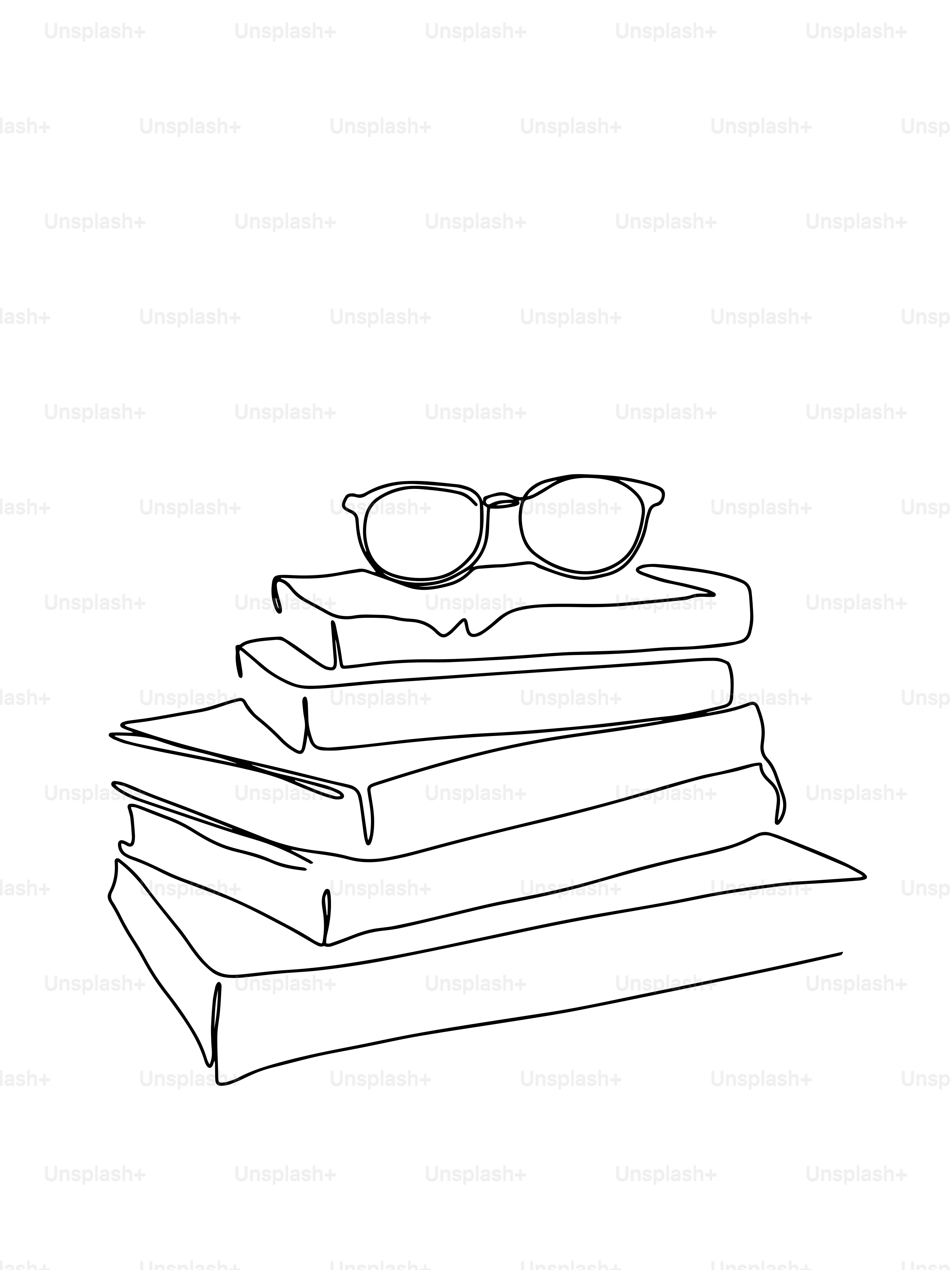 A stack of books with glasses on top