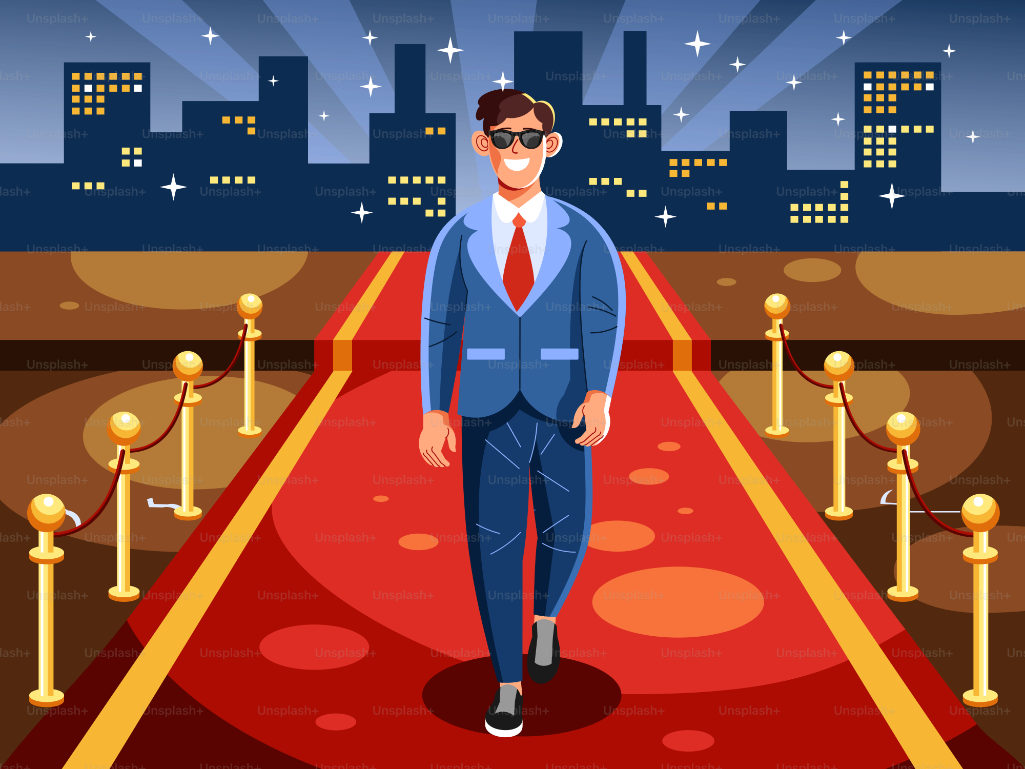 A man in a suit and sunglasses walking down a red carpet