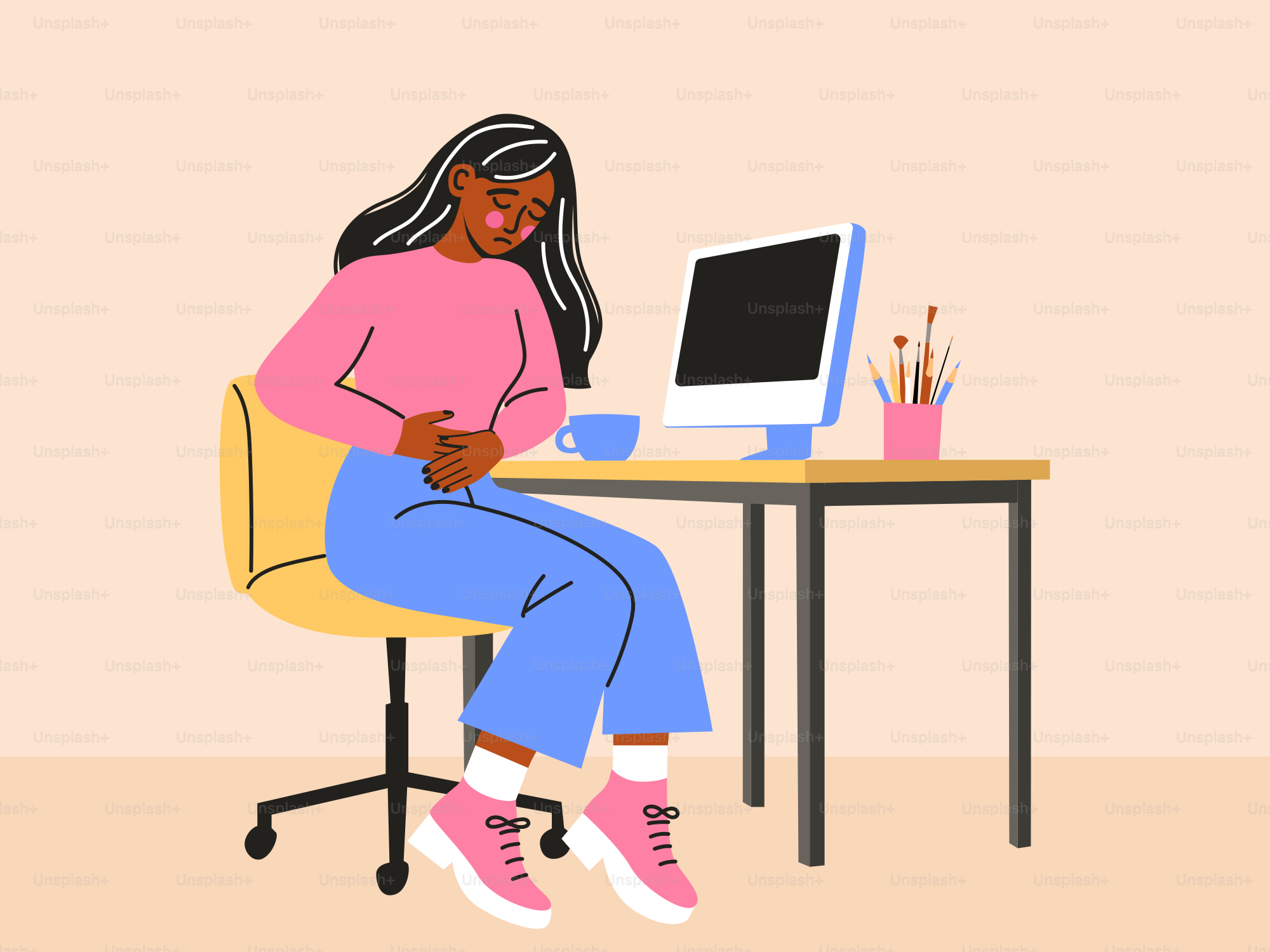 A woman sitting at a desk in front of a computer