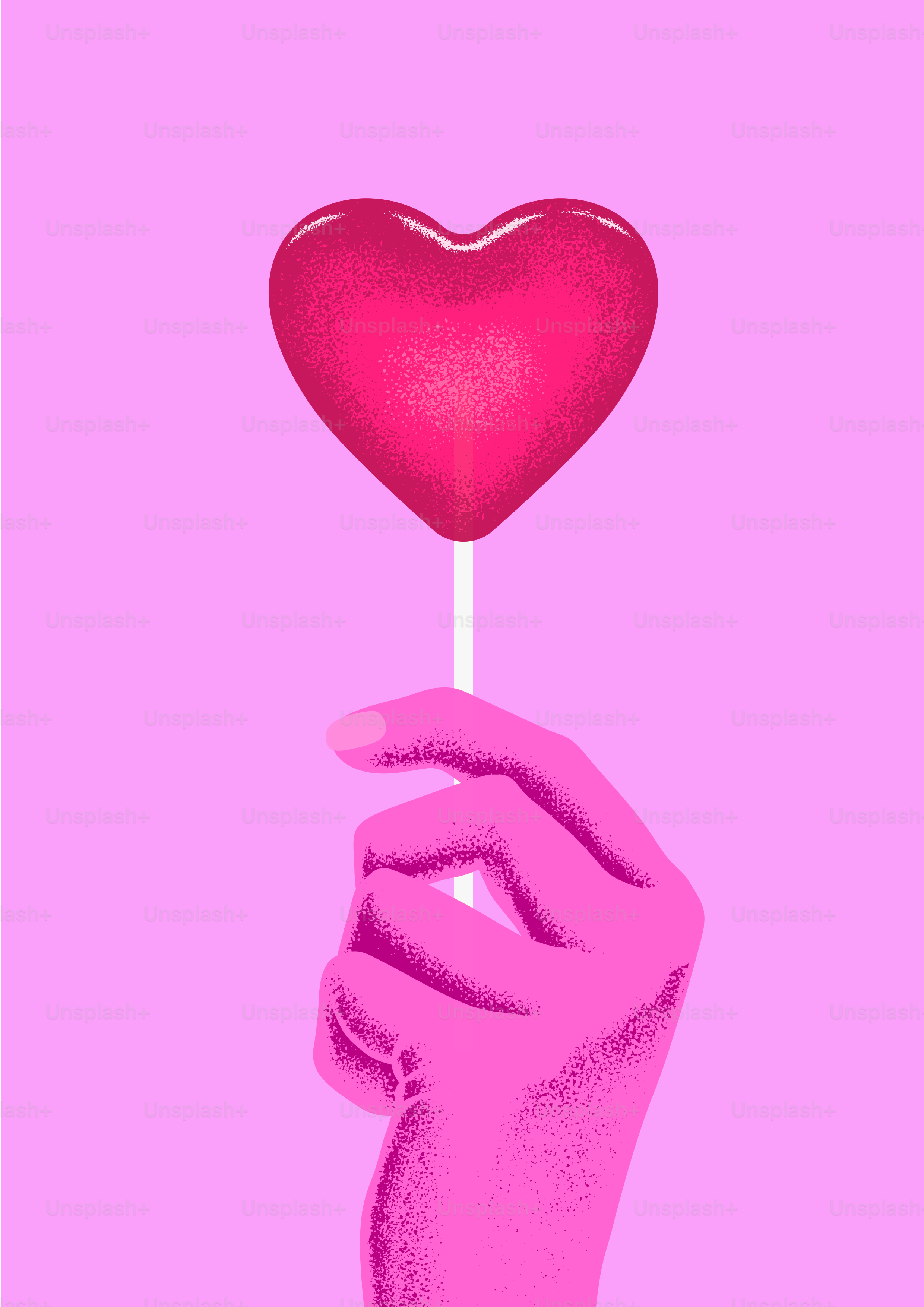 A hand holding a heart lollipop on a pink background