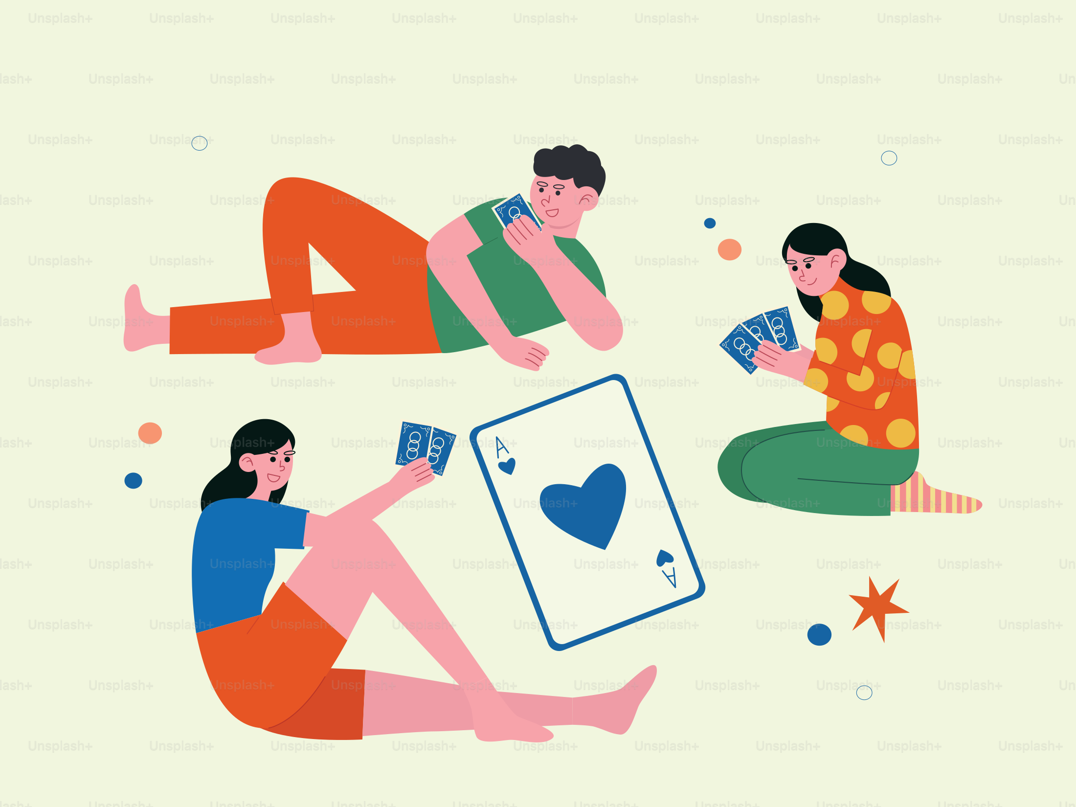 A couple of people sitting on the ground playing cards