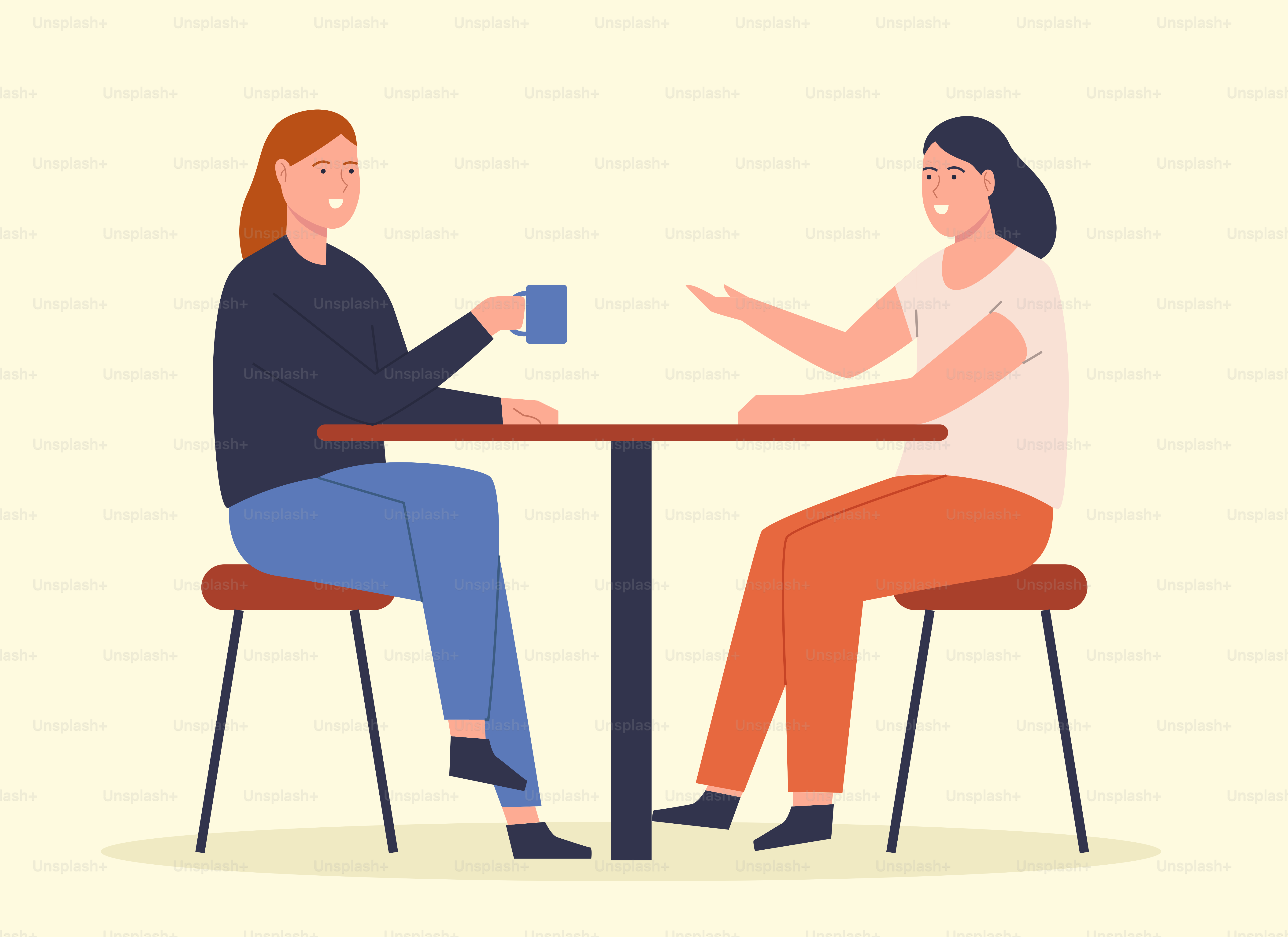 Two women sitting at a table having a conversation