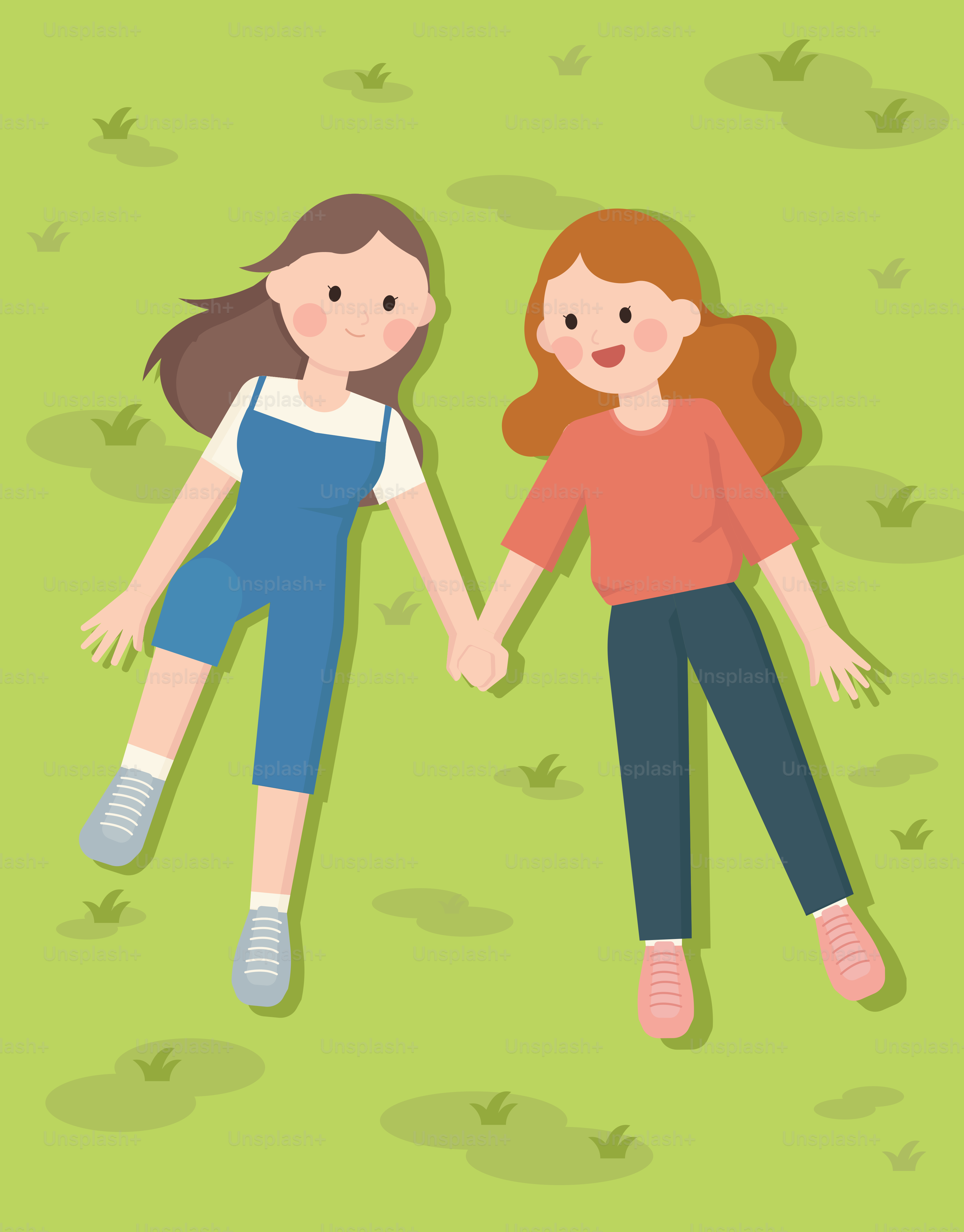 A couple of women laying on top of a green field