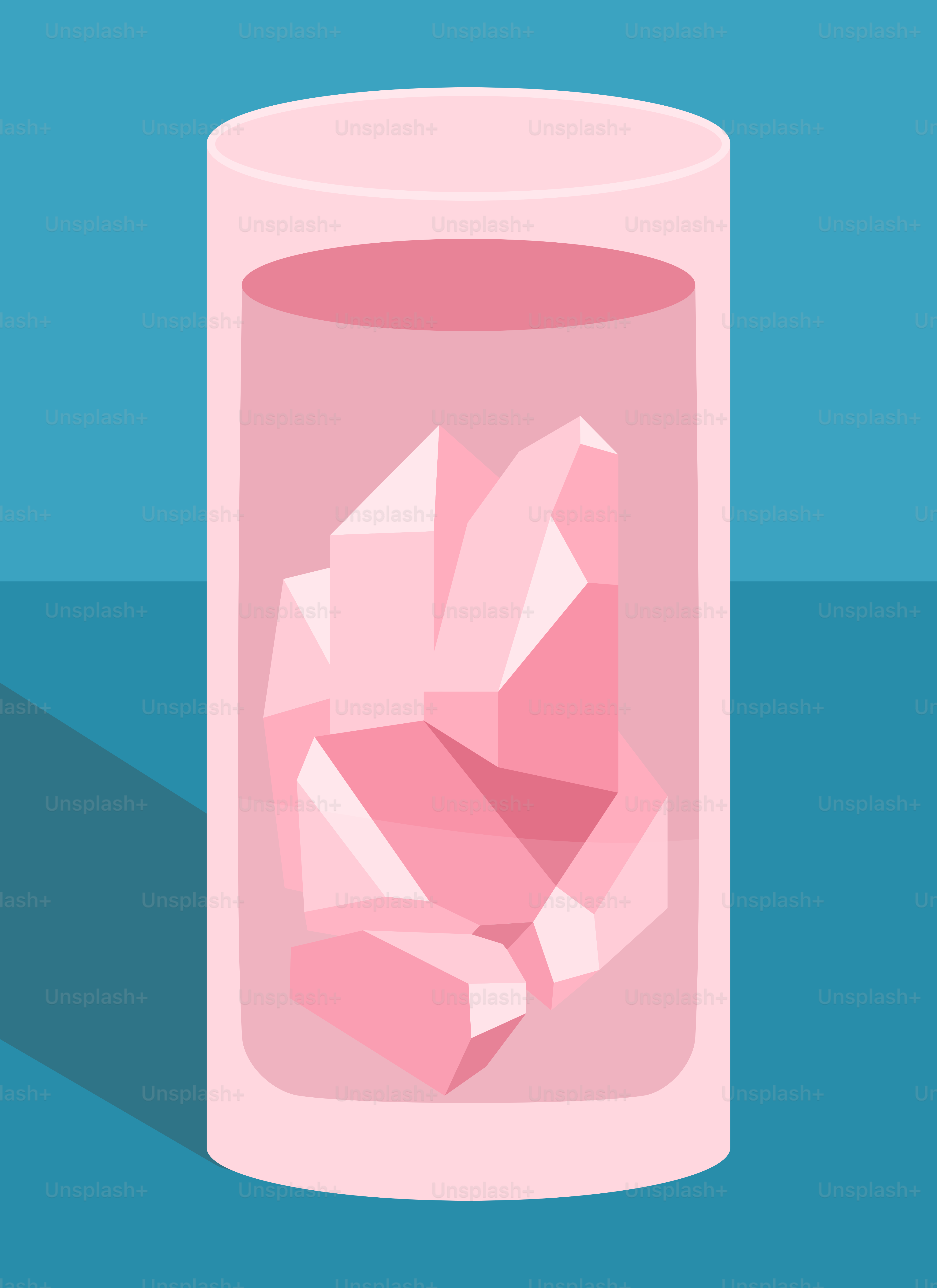 A glass of pink liquid with ice cubes in it