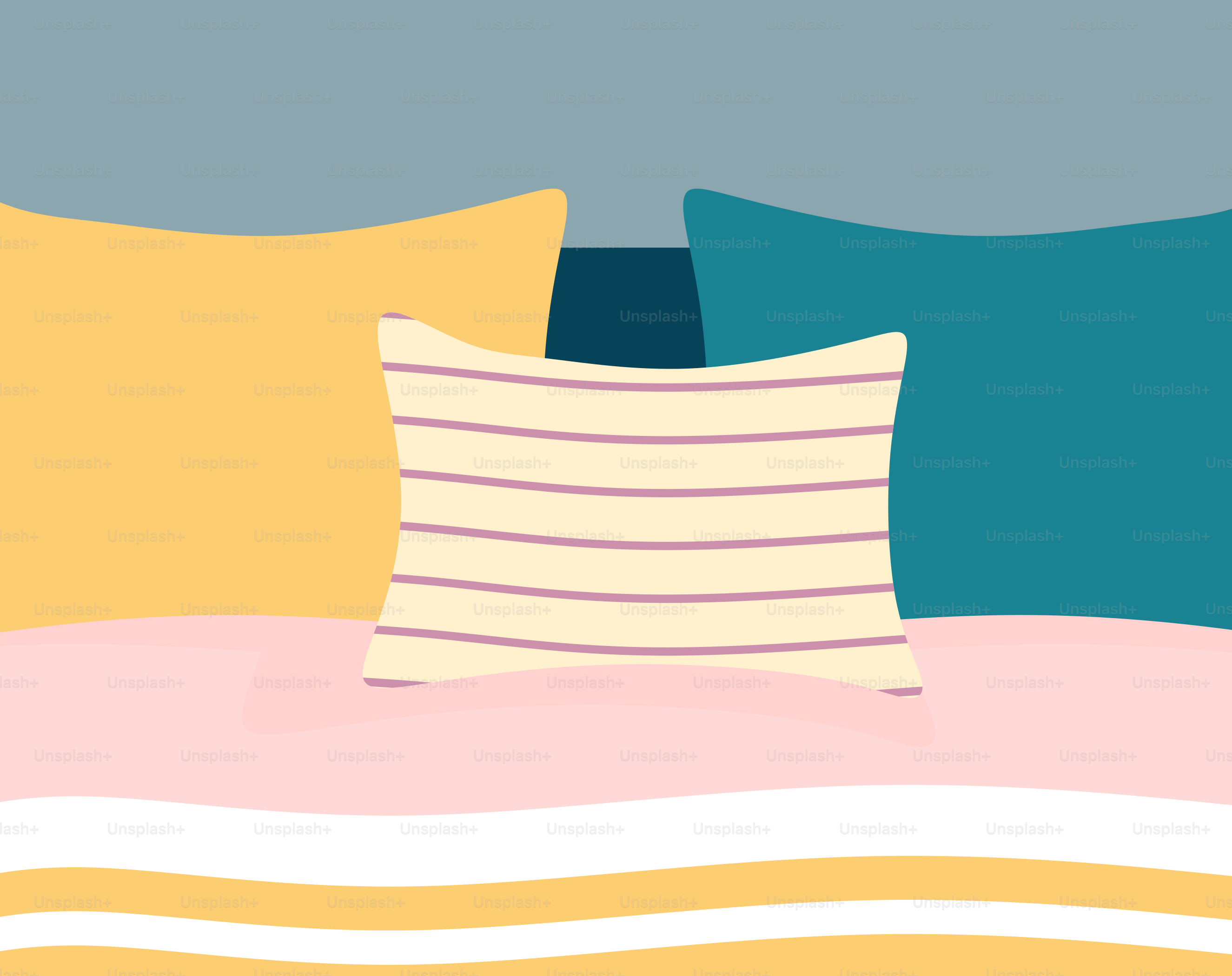 A close up of a bed with pillows and a blanket