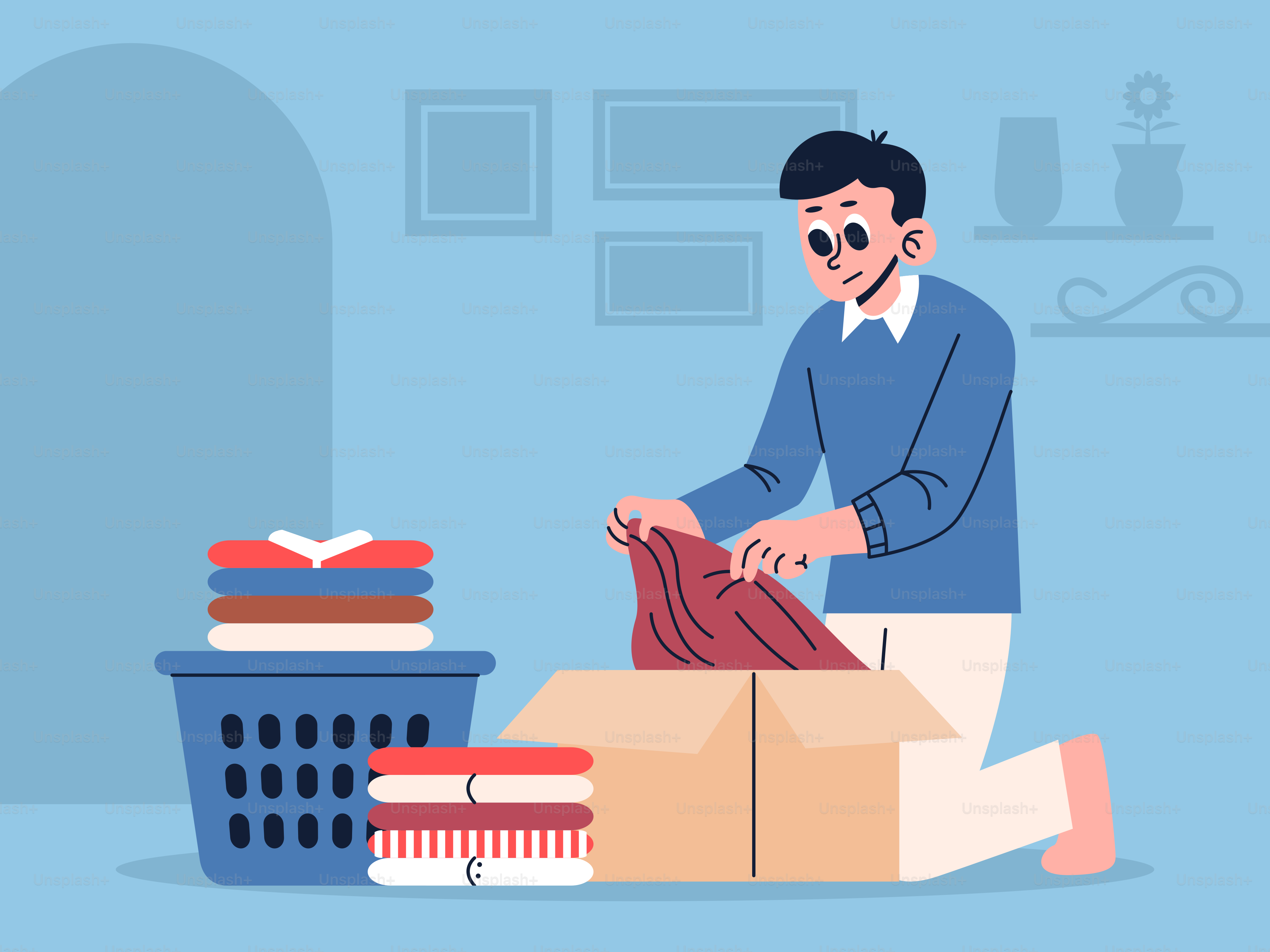 A man sitting on the floor next to a pile of clothes