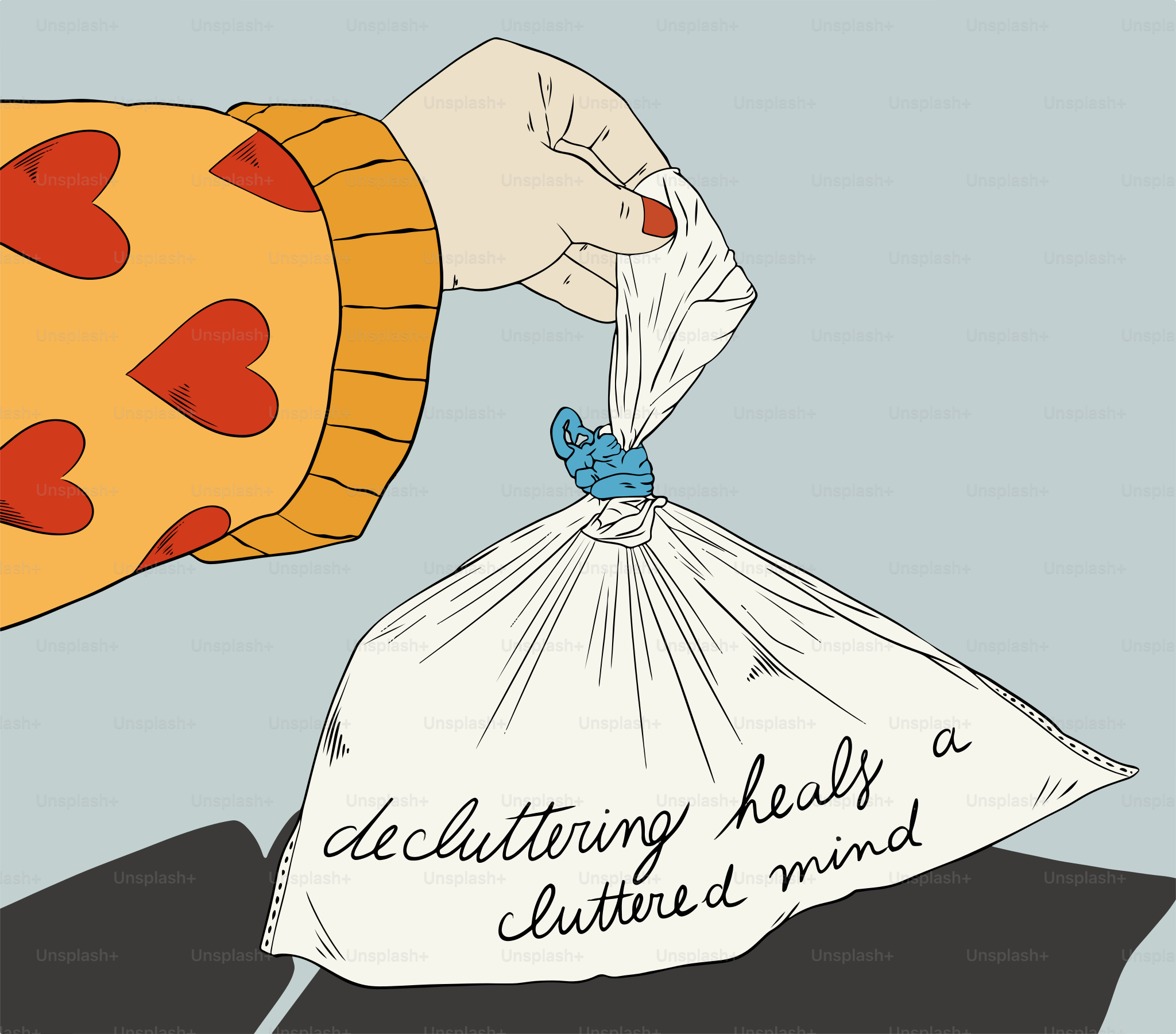 A hand holding a bag with a heart on it