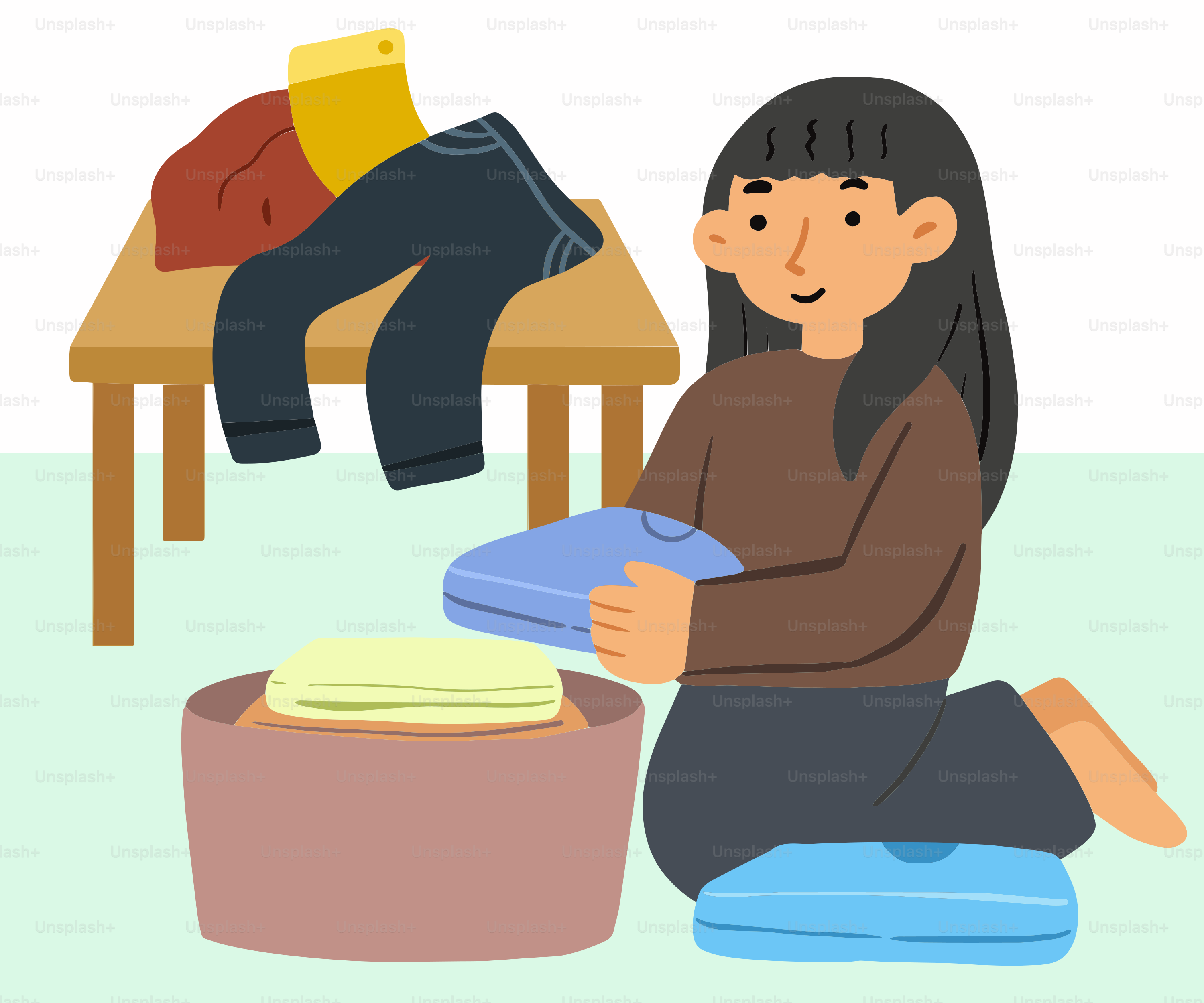 A woman sitting on the floor with a pile of clothes